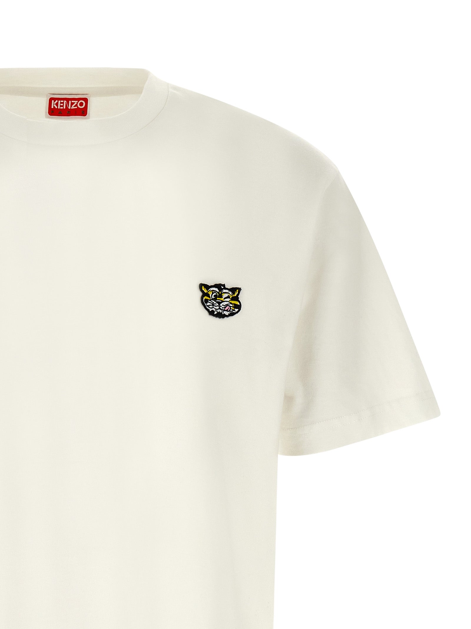 Experience the allure of Kenzo's White Cotton T-Shirt, a luxurious expression of individuality crafted from premium cotton, perfect for those who embrace elegance and adventure.