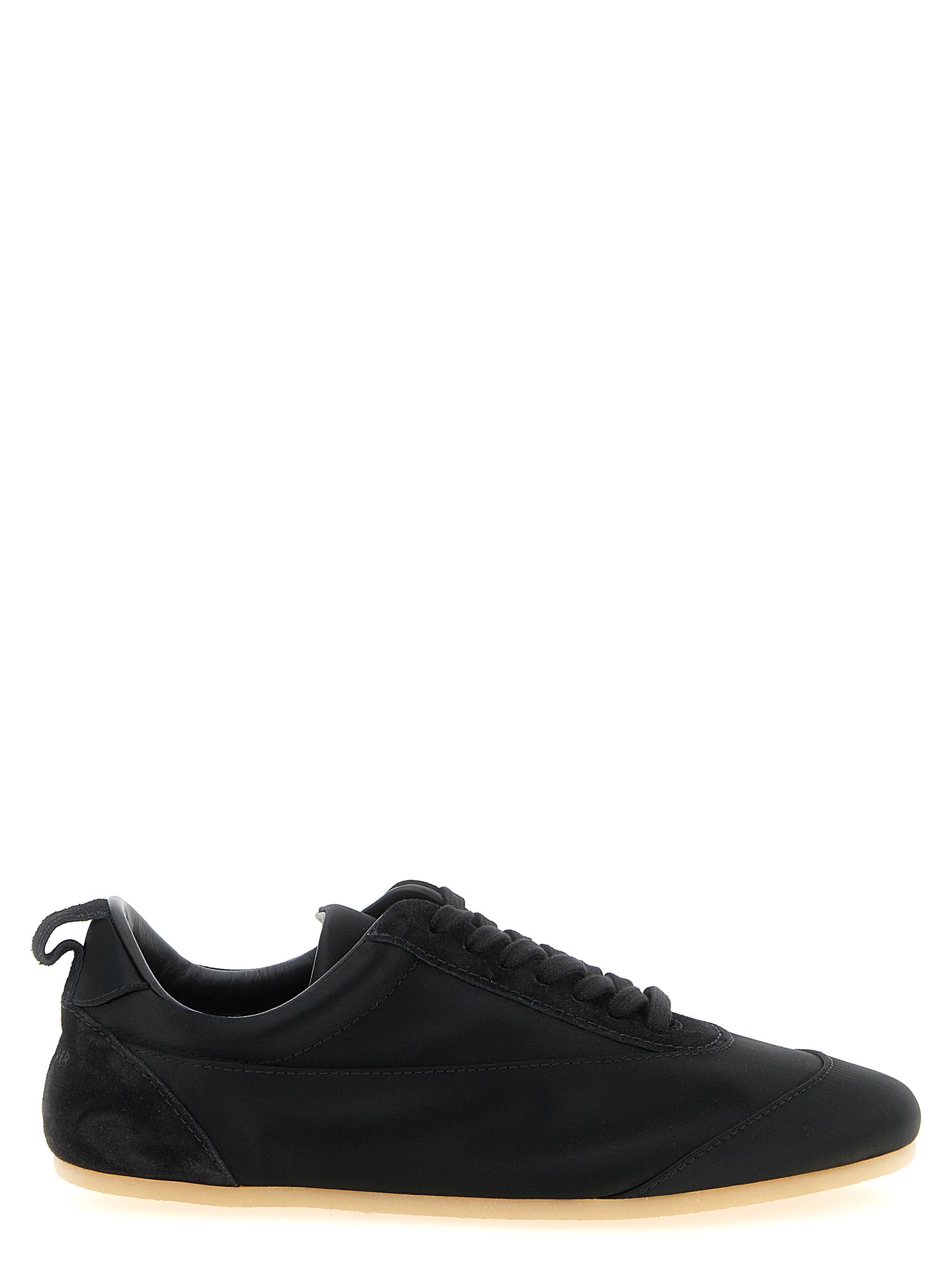 Experience the exquisite allure of Jil Sander's Black Cotton Low Top Sneakers, where artisanal craftsmanship meets luxurious materials, perfect for the discerning individual.