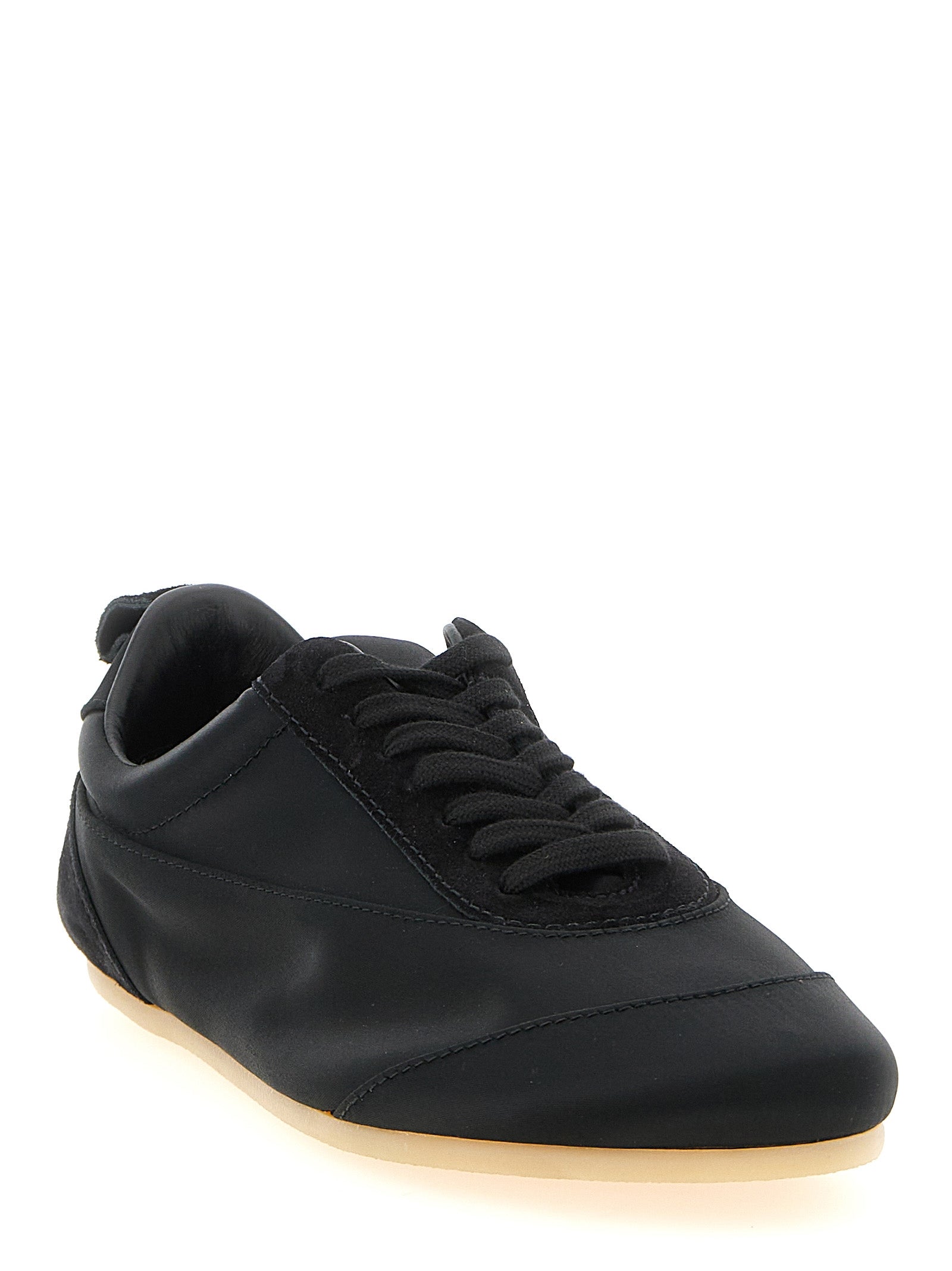 Discover Jil Sander's Black Cotton Low Top Sneakers, a masterpiece of artisanal luxury crafted in Italy, blending elegance and comfort for the discerning individual.