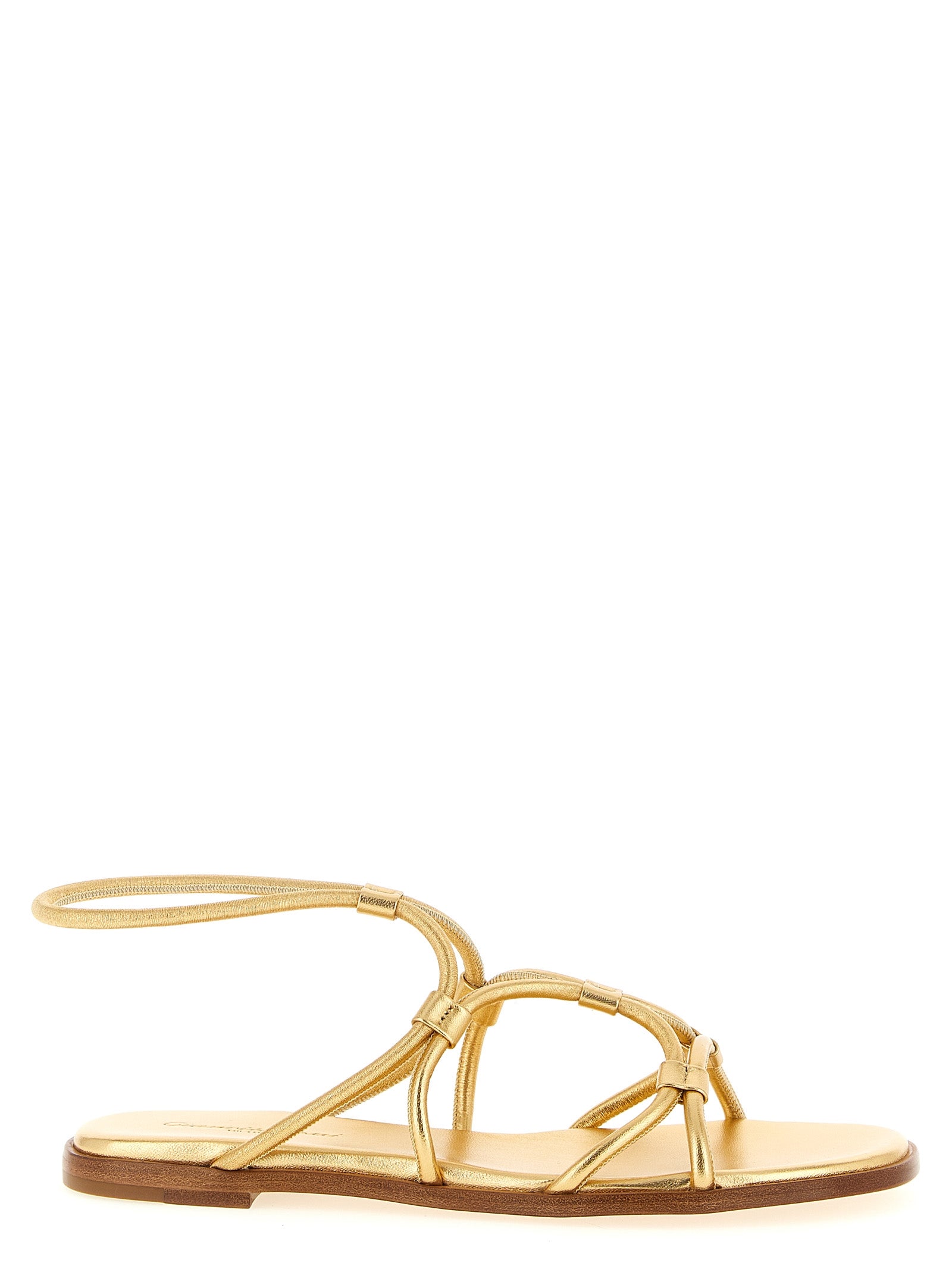 Experience the allure of Gianvito Rossi's gold lamb leather flat sandals, where Italian craftsmanship meets timeless elegance, perfect for the discerning individual.