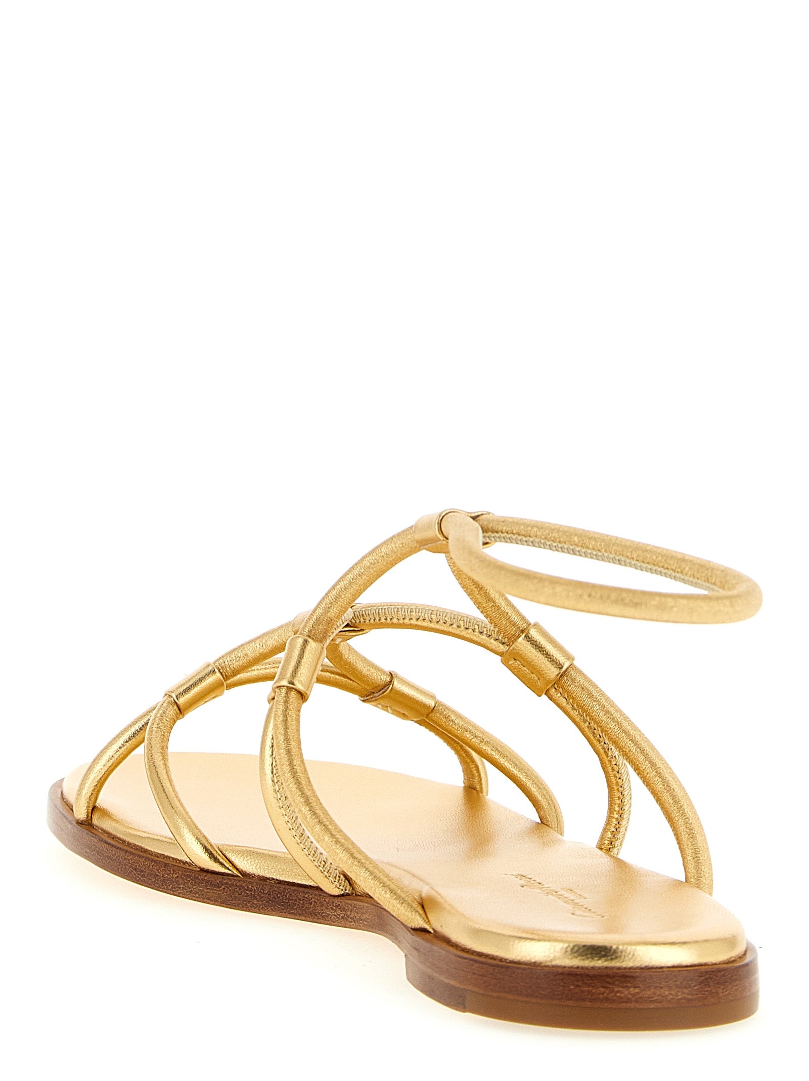 Step into unparalleled elegance with Gianvito Rossi's gold lamb leather flat sandals, where Italian craftsmanship meets sophisticated allure for the discerning individual.