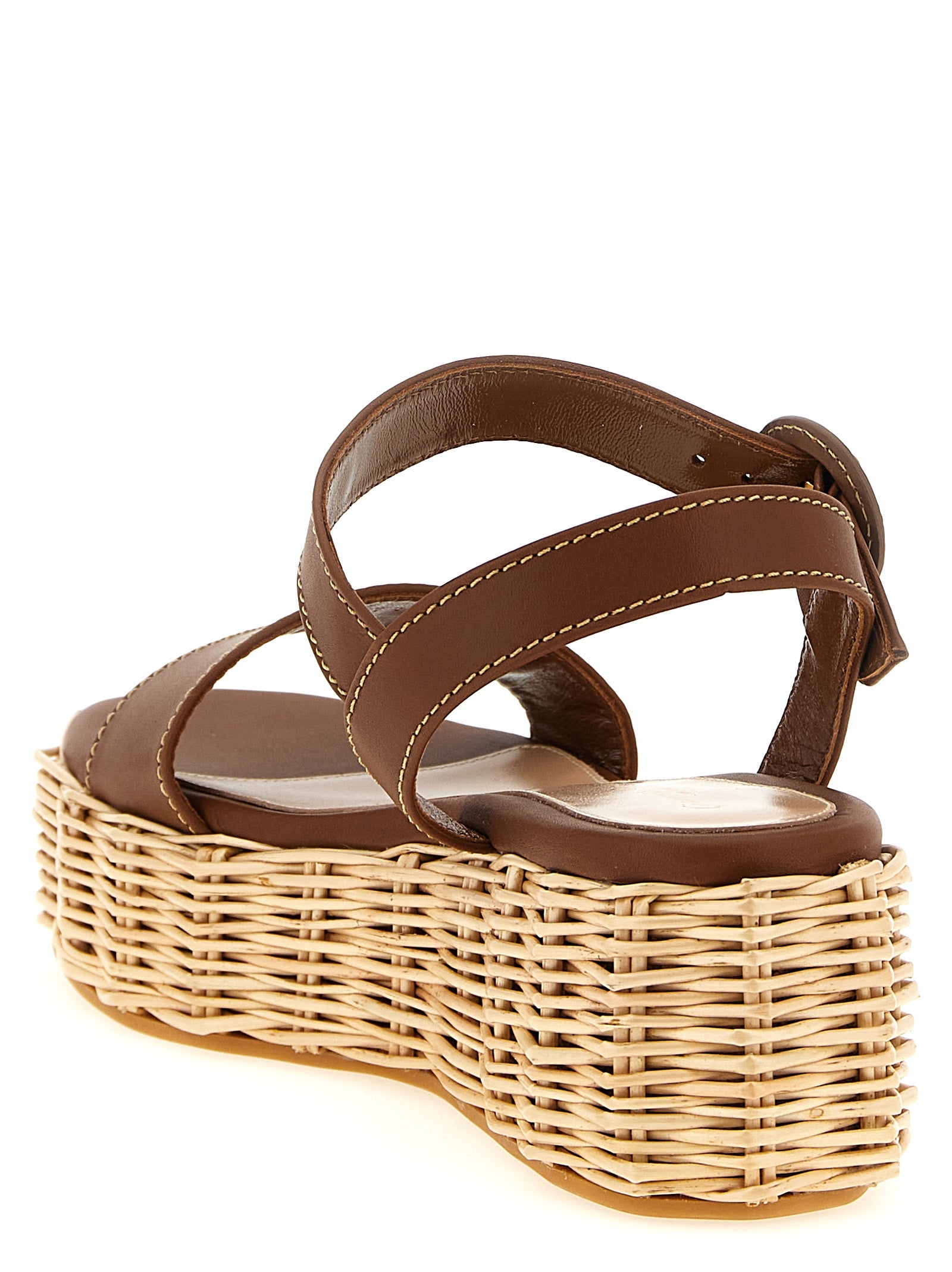 Indulge in Gianvito Rossi's Brown Calfskin Wedge Sandals, where Italian craftsmanship meets timeless elegance, elevating your style for any occasion.