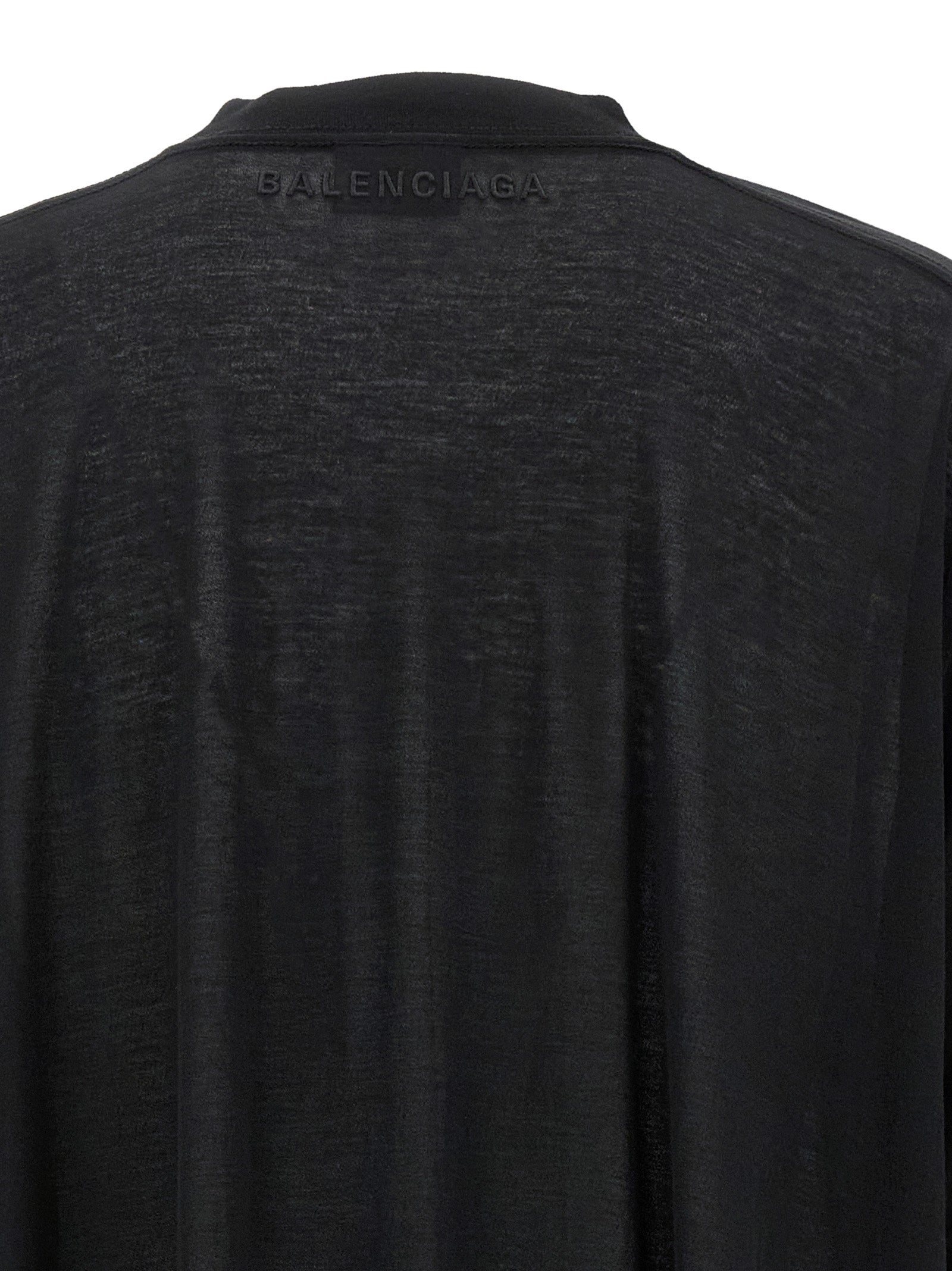 Discover the Balenciaga Black Cotton Casual Dress, a masterpiece of asymmetric luxury couture, crafted for those who embrace sophistication and individuality.