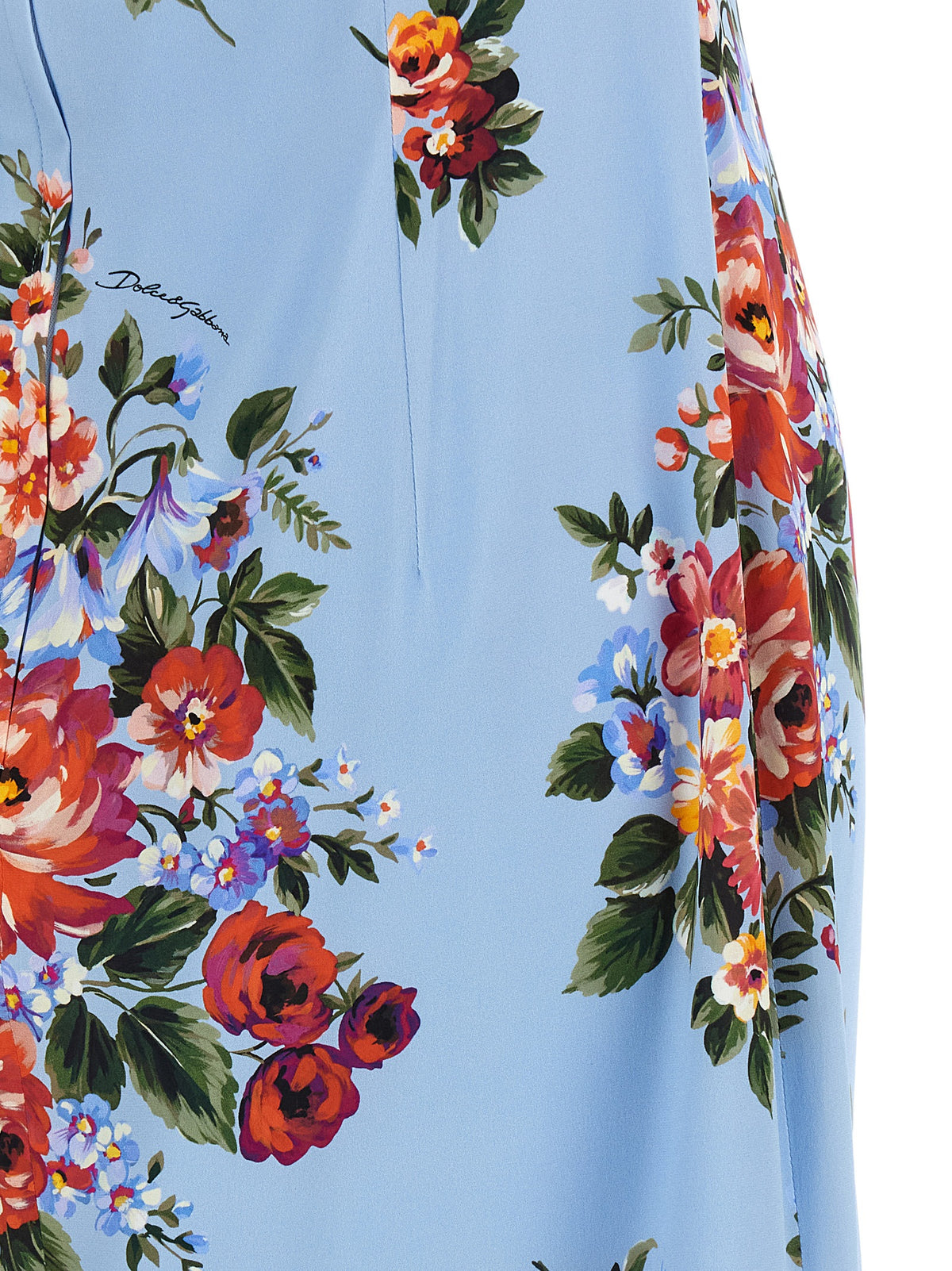 Indulge in the exquisite Dolce & Gabbana Blue Silk Midi Dress, a masterpiece of floral elegance crafted from luxurious silk, perfect for the discerning individual seeking sophistication.