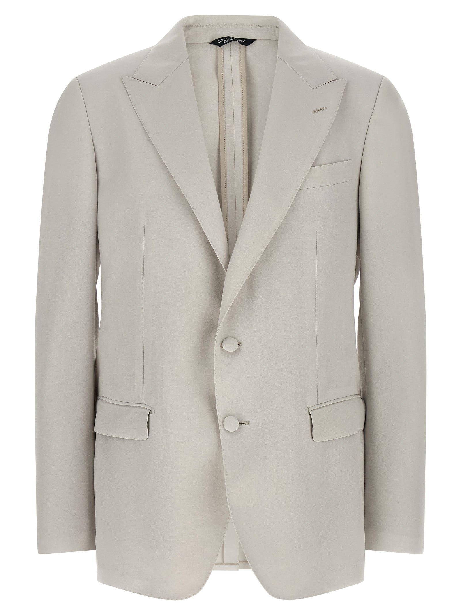Discover the Dolce & Gabbana Gray Virgin Wool Blazer, a masterpiece of Italian craftsmanship that embodies timeless elegance and sophistication for the discerning individual.