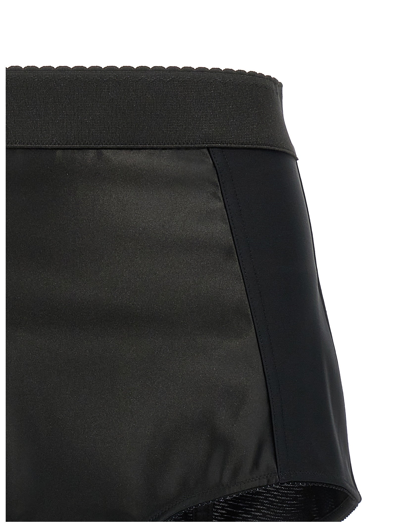 Discover the Dolce & Gabbana Black Polyamide Bermuda Shorts, a luxurious blend of elegance and comfort, perfect for the discerning individual who values timeless sophistication.