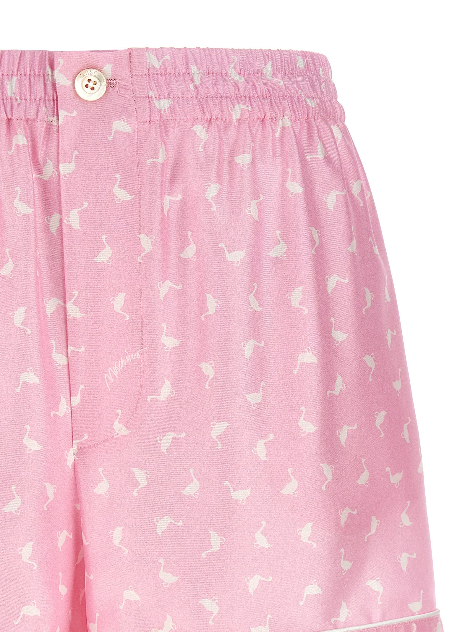 Elevate your style with Moschino Multicolor Silk Bermuda Shorts, crafted from luxurious silk, featuring a striking print and impeccable Italian craftsmanship for the discerning fashionista.