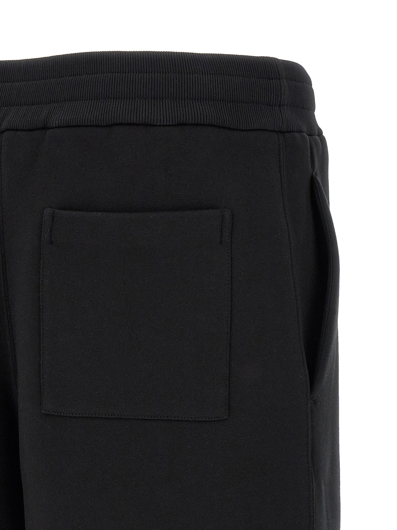 Elevate your wardrobe with Jil Sander Black Cotton Bermuda Shorts, crafted from luxurious 100% cotton, embodying effortless elegance for the discerning individual.