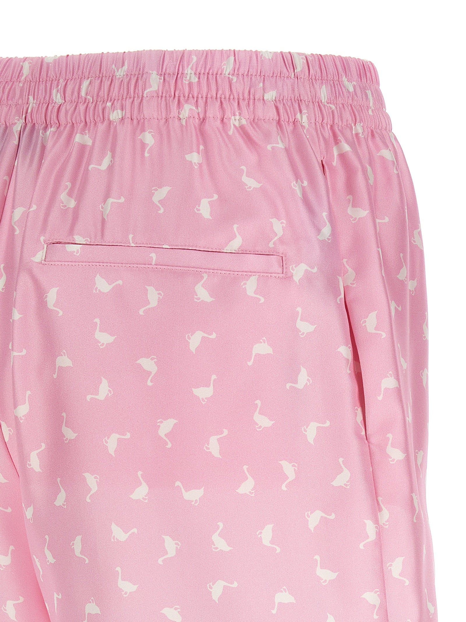 Elevate your style with Moschino Multicolor Silk Bermuda Shorts, crafted from luxurious silk and adorned with a captivating print, embodying sophistication and allure.