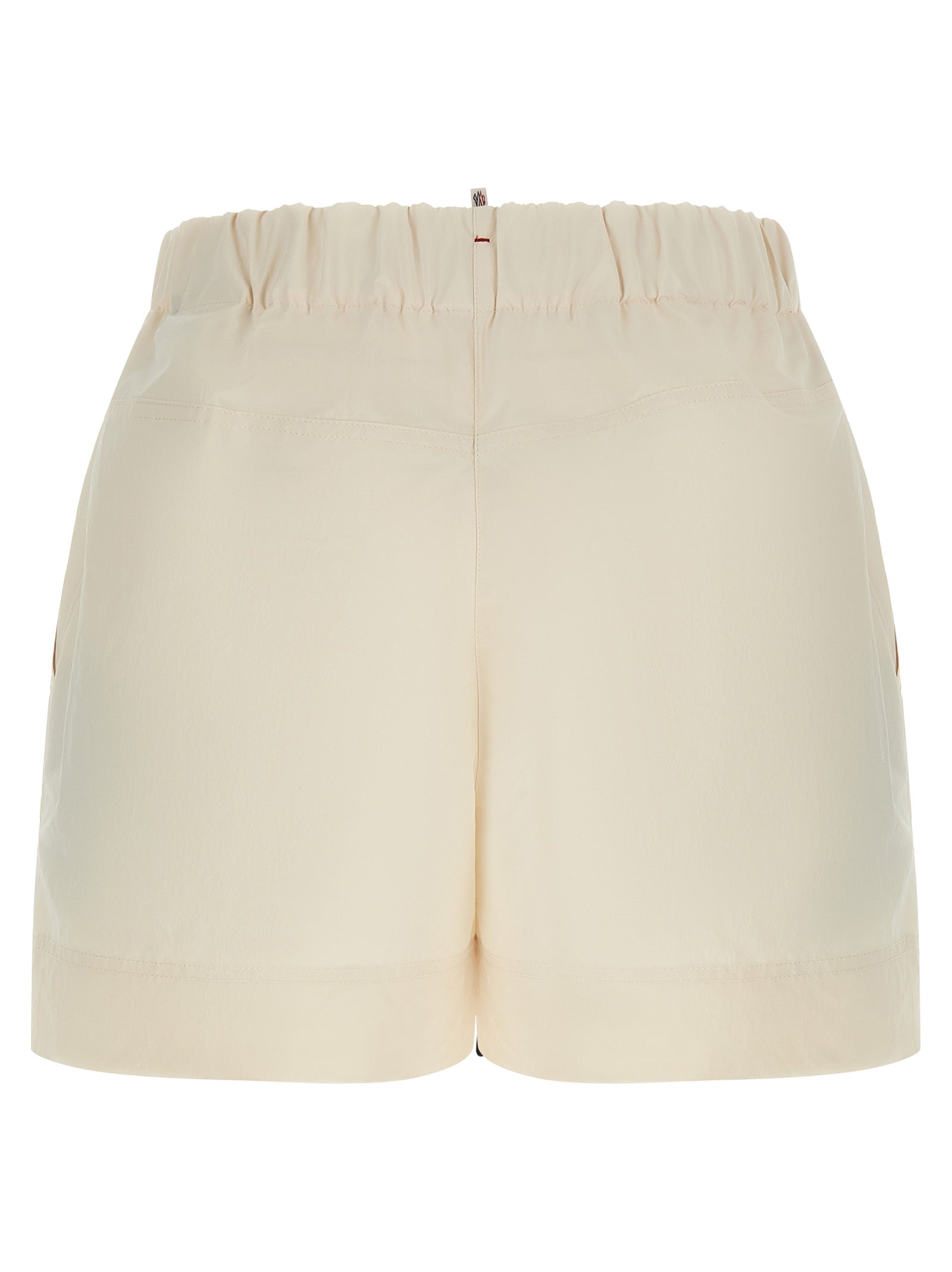 Elevate your summer wardrobe with Moncler Grenoble Bermuda Shorts, crafted from luxurious 100% polyester, blending elegance and practicality for the discerning individual.