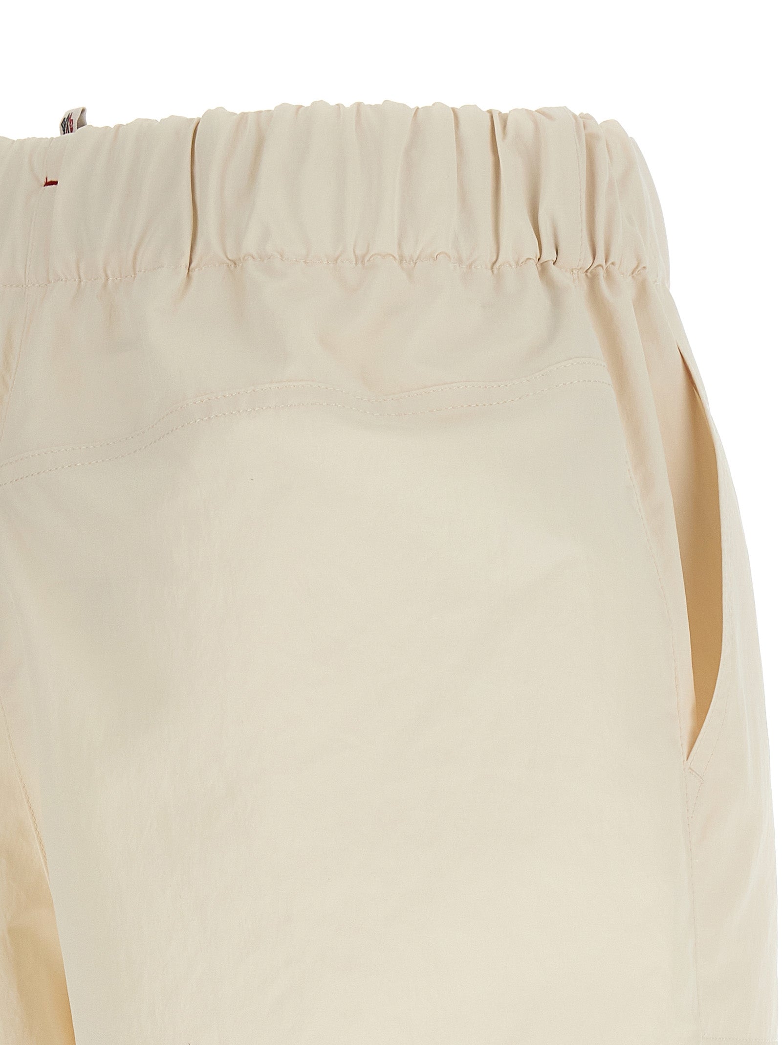 Elevate your summer wardrobe with Moncler Grenoble Bermuda Shorts, crafted from luxurious 100% polyester, blending elegance and practicality for the discerning individual.
