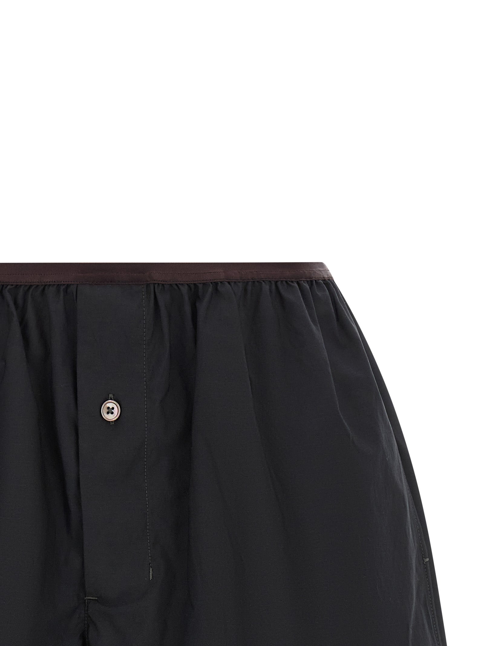 Indulge in the exquisite craftsmanship of Lemaire's Gray Cotton Bermuda Shorts, where luxurious cotton and silk blend seamlessly for a sophisticated silhouette.