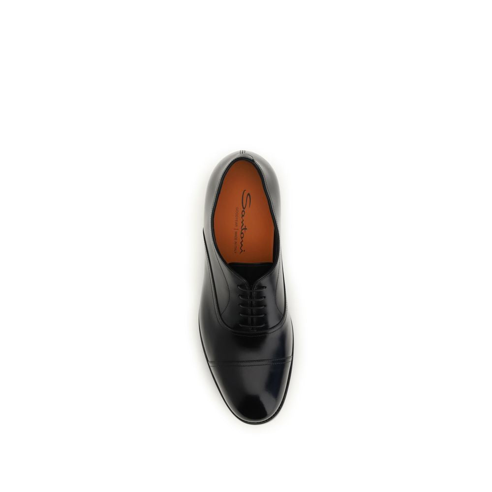 Discover the Santoni Black Calf Leather Bos Taurus Oxfords, where exquisite craftsmanship meets timeless elegance, perfect for the discerning individual who commands attention.