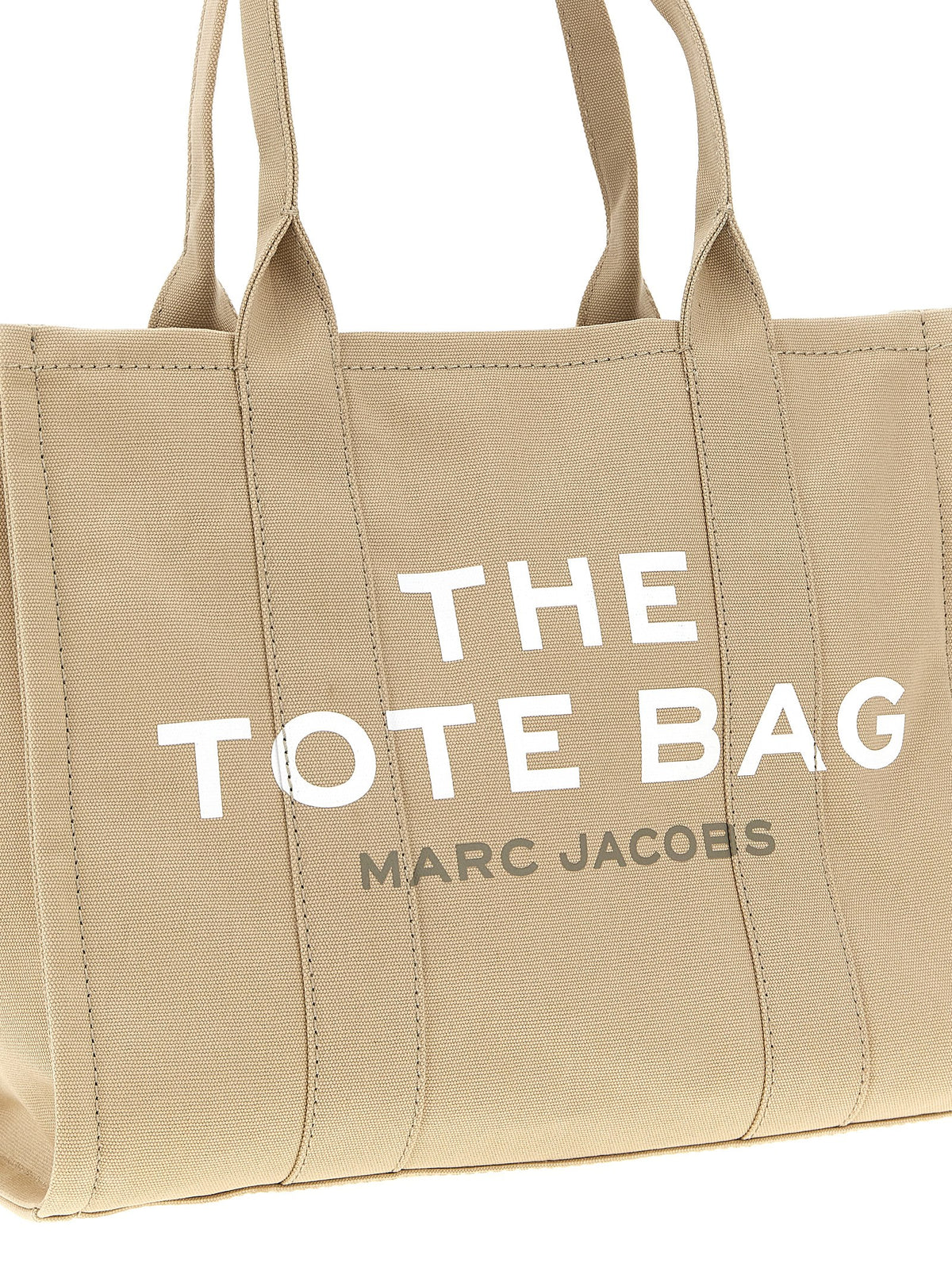 Elevate your style with the Marc Jacobs Beige Cotton Tote Bag from The Canvas Large Tote collection, a testament to artisanal luxury and timeless sophistication.