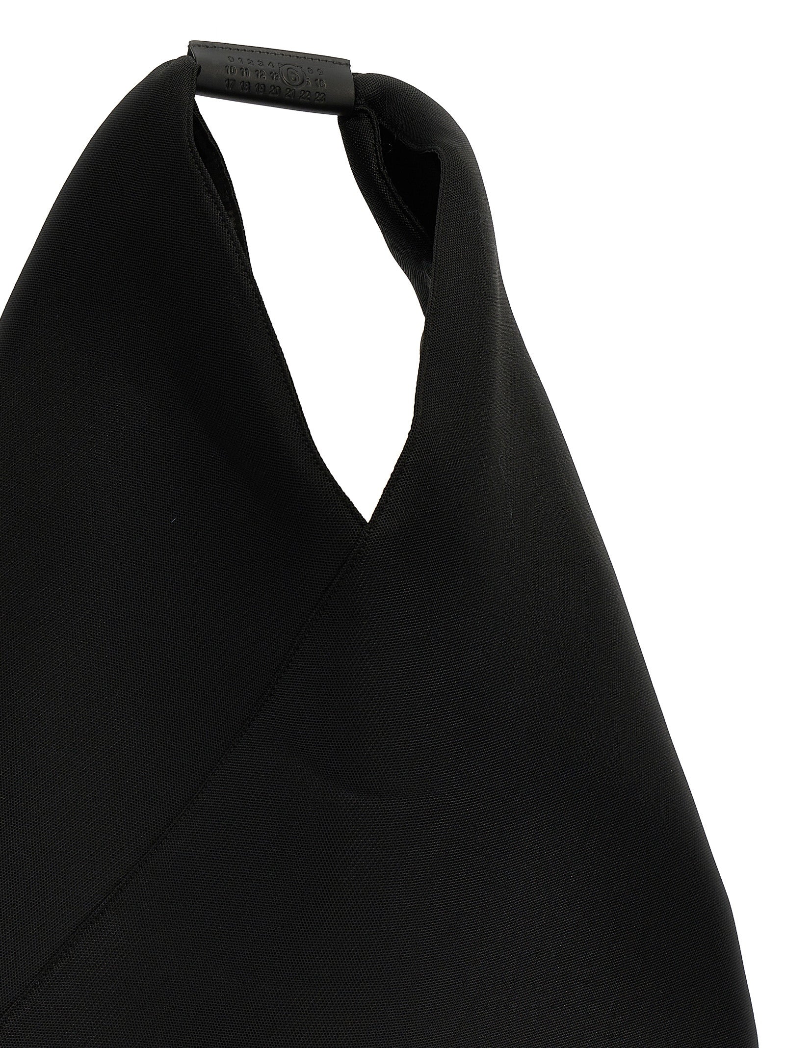 Discover the MM6 Maison Margiela Black Polyester Shoulder Bag, a masterpiece of artisanal luxury that elevates your style with avant-garde elegance and timeless sophistication.