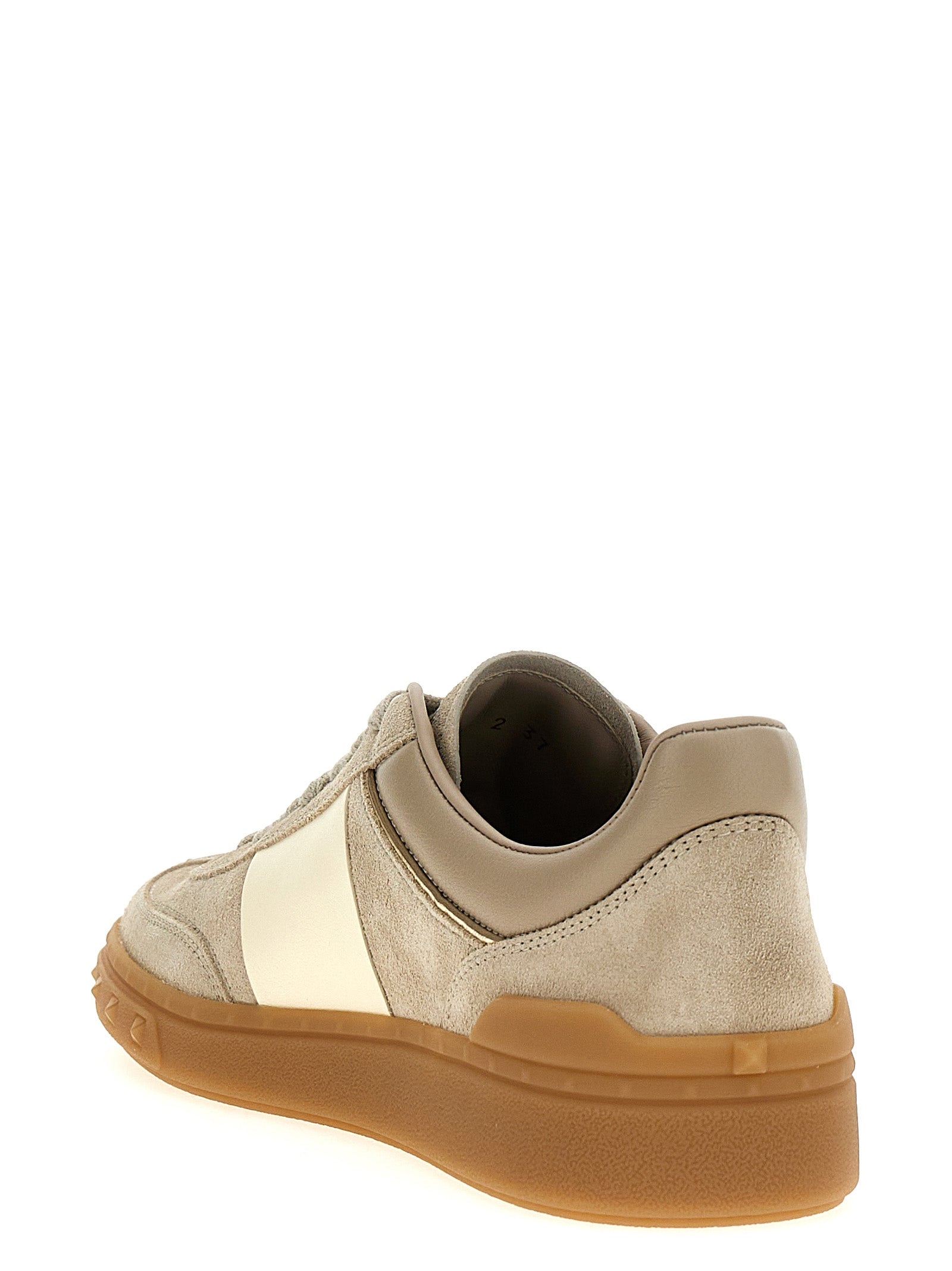Experience the allure of Valentino Garavani's Beige Calfskin Low Top Sneakers, where exquisite craftsmanship meets luxurious design, perfect for the discerning individual.