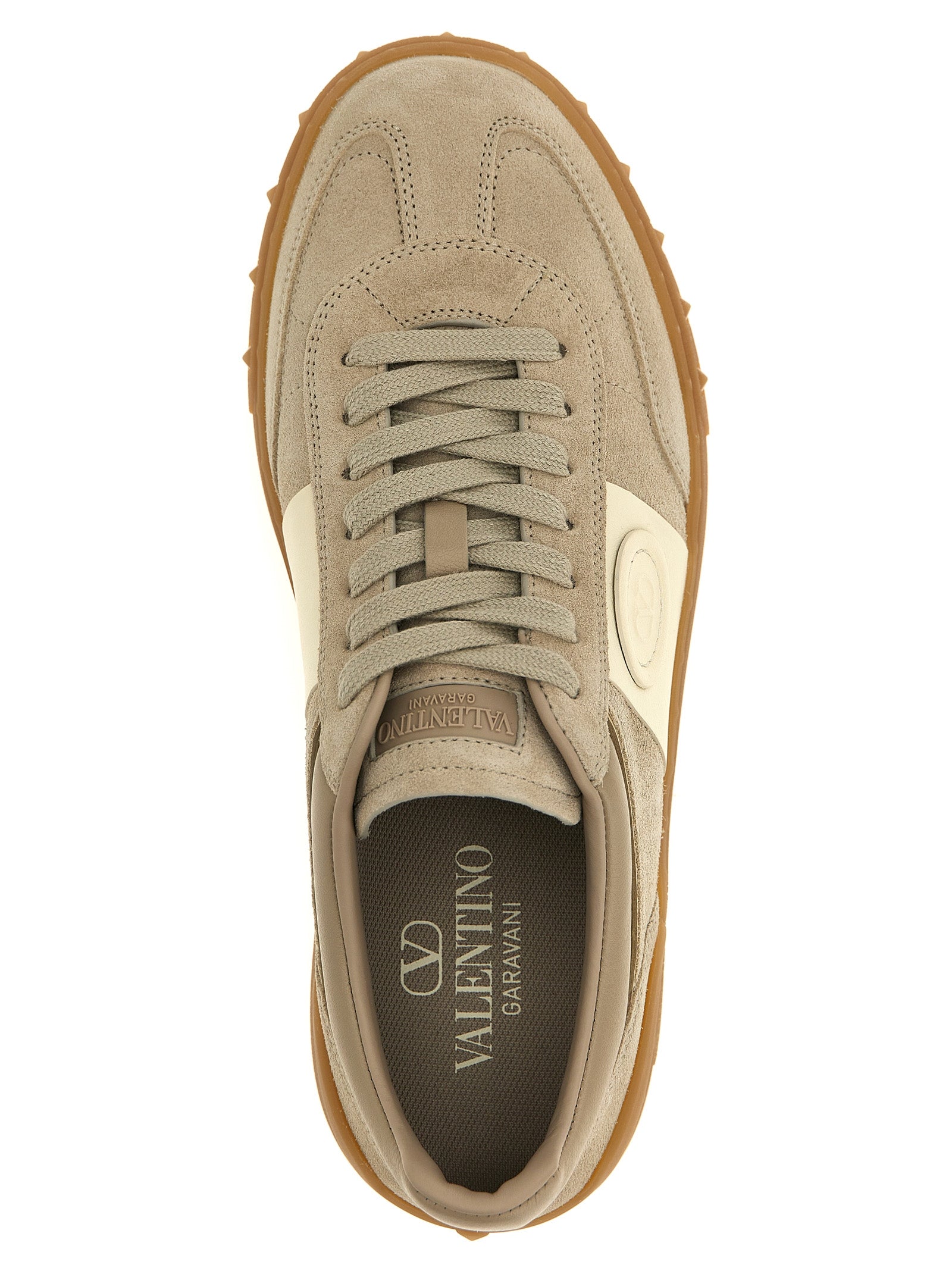 Discover the allure of Valentino Garavani's Beige Calfskin Low Top Sneakers, where exquisite craftsmanship meets bold design, elevating your everyday elegance.