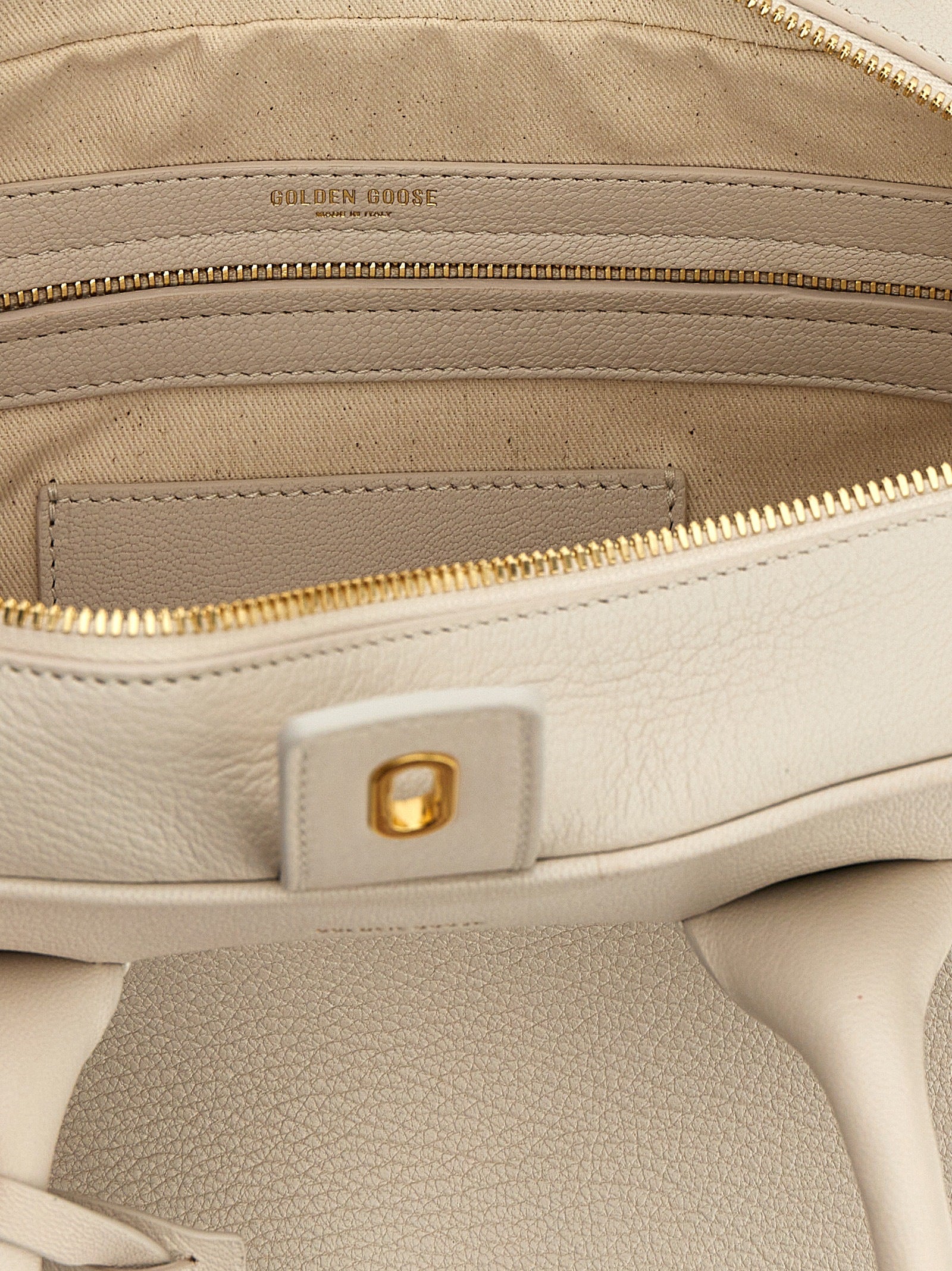 Discover the Golden Goose White Goatskin Handbag, a masterpiece of Italian craftsmanship in 100% goat leather, embodying timeless elegance and sophisticated allure.