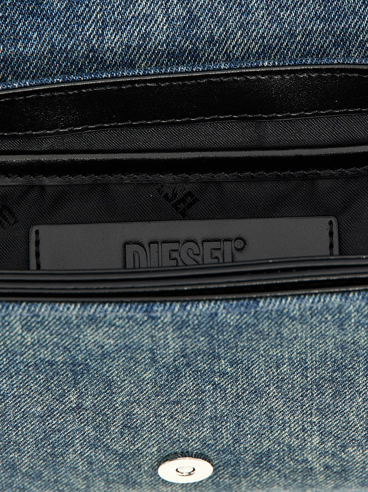 Elevate your style with the Diesel Blue Cotton Shoulder Bag, a luxurious blend of cotton and PMU, showcasing exquisite craftsmanship and timeless elegance for every occasion.