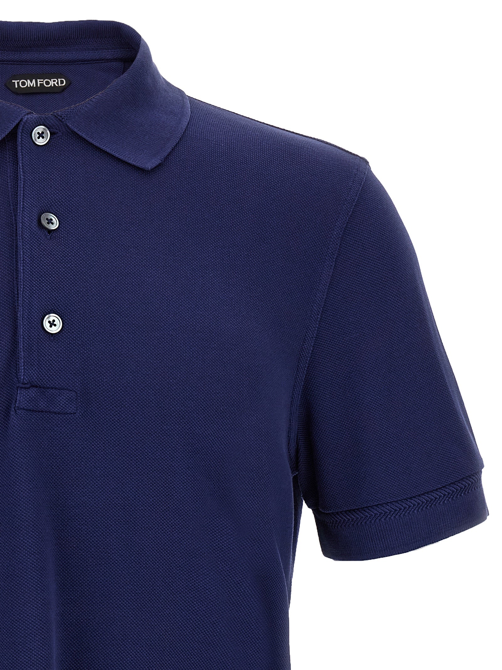 Elevate your wardrobe with the Tom Ford Blue Lyocell Polo Shirt, a luxurious blend of lyocell and cotton, embodying timeless elegance and sophisticated craftsmanship.