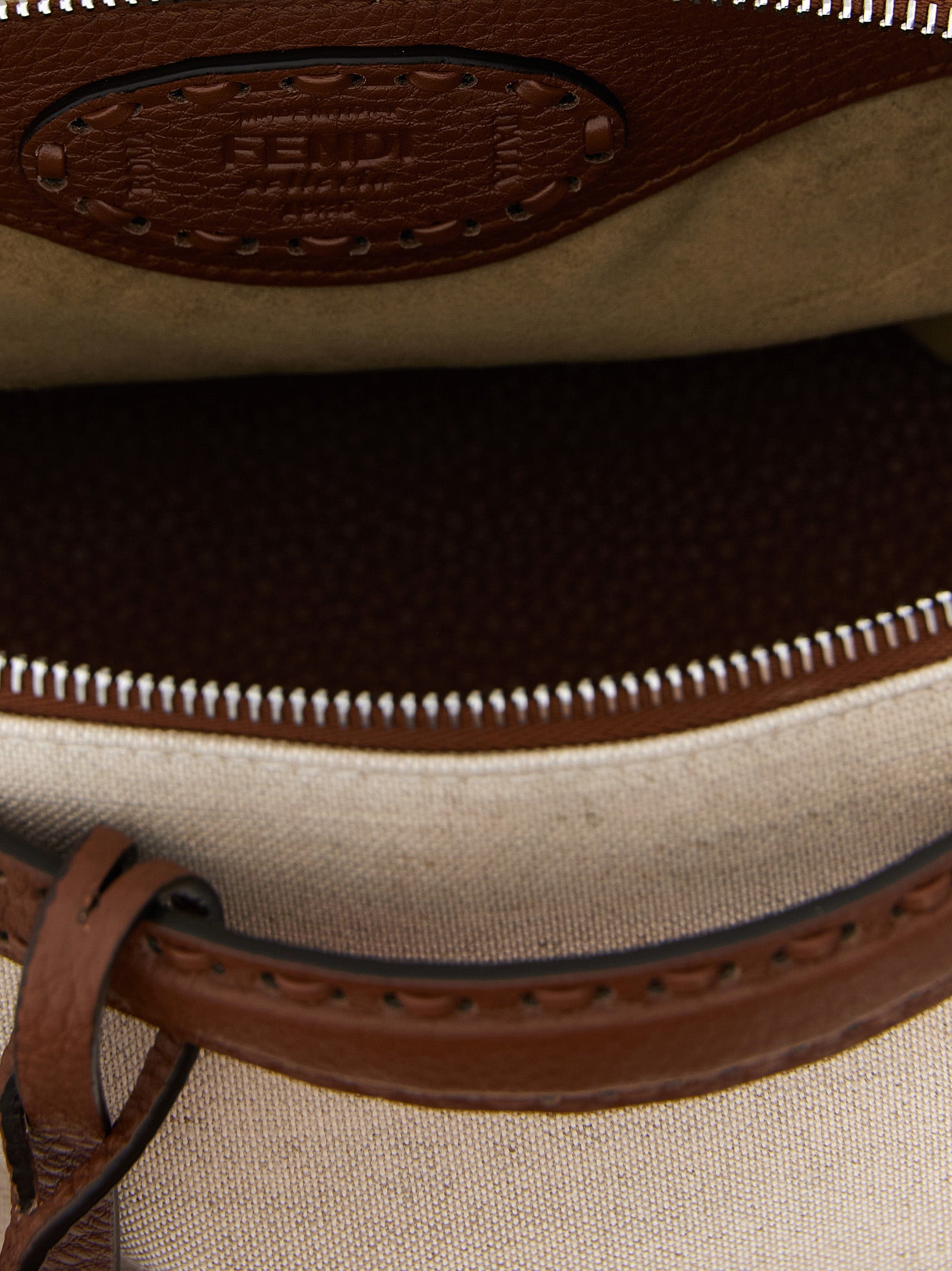 Elevate your style with the Fendi Beige Polyethylene Handbag, a masterpiece of Italian craftsmanship that embodies luxury and sophistication for the discerning individual.