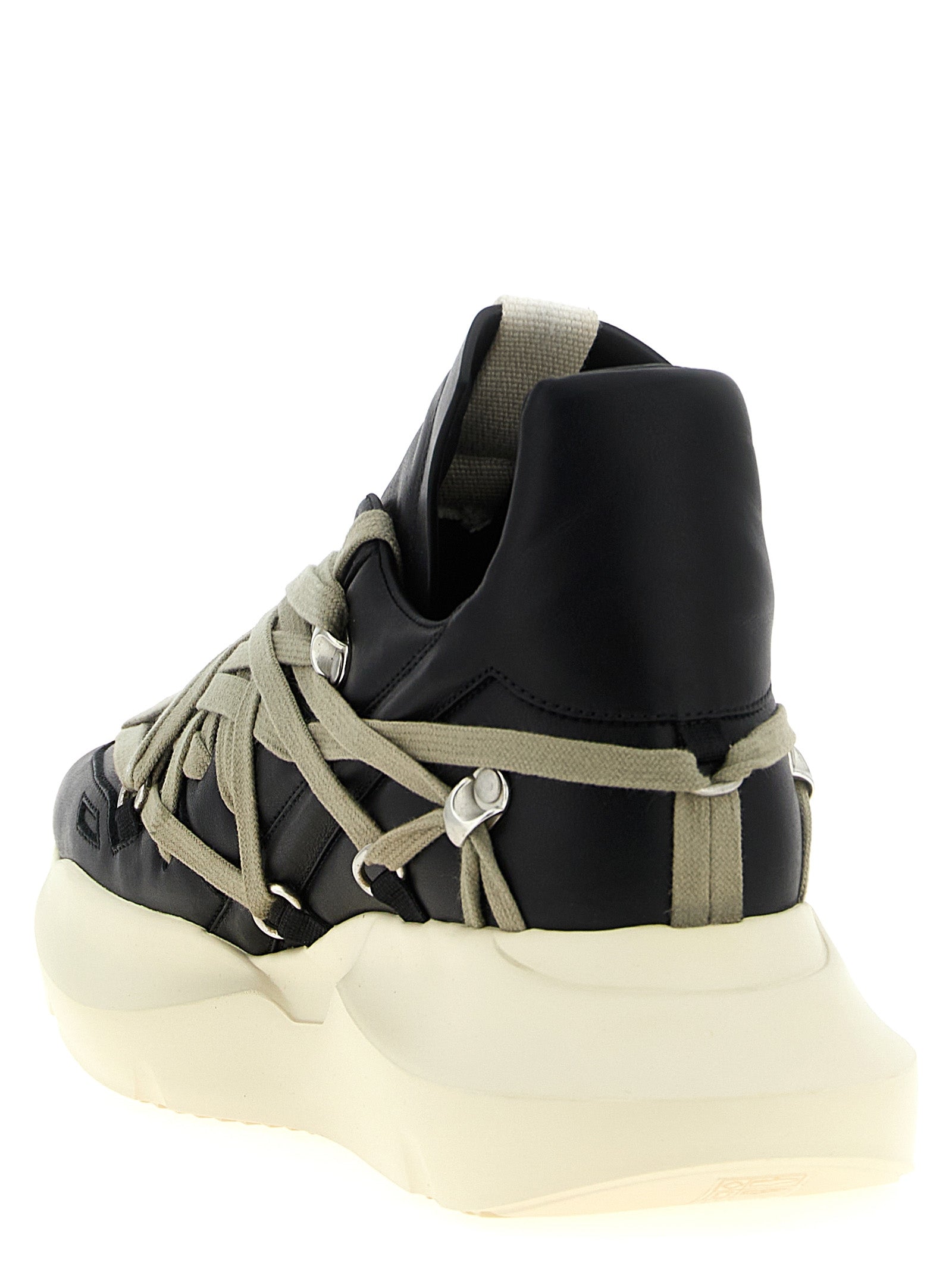 Elevate your style with Rick Owens' 'Megalace Geth Runner' sneakers, crafted from exquisite black calfskin leather, merging avant-garde design with luxurious comfort.