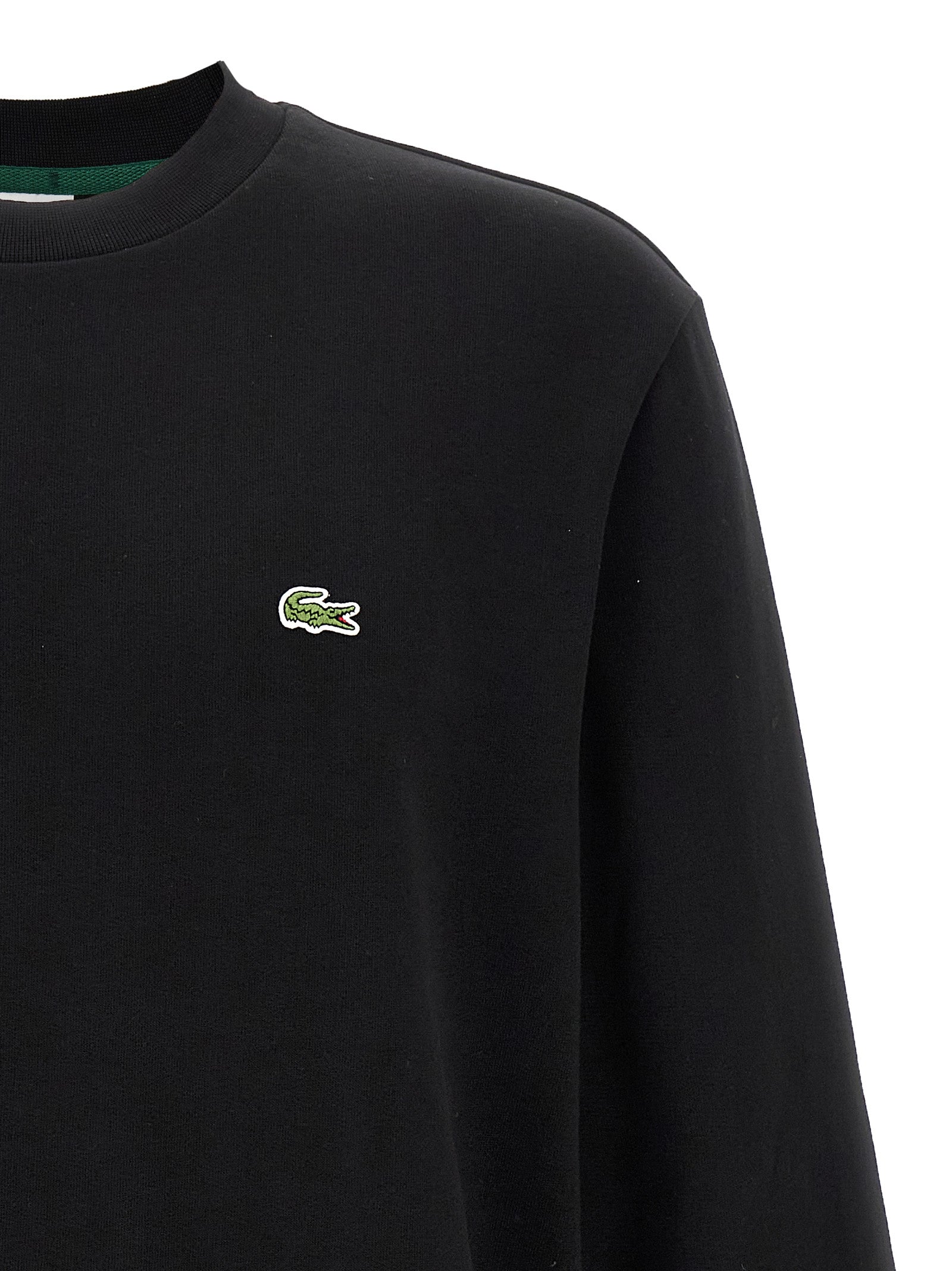 Indulge in the Lacoste Black Cotton Sweatshirt, a blend of luxurious comfort and sophisticated style, perfect for those who embrace elegance in every moment.