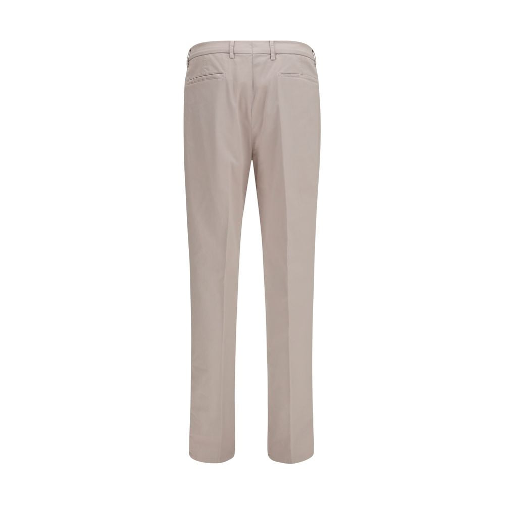 Discover the Brunello Cucinelli Beige Cotton Chino Pants, a blend of exquisite craftsmanship and timeless elegance, perfect for elevating any sophisticated wardrobe.
