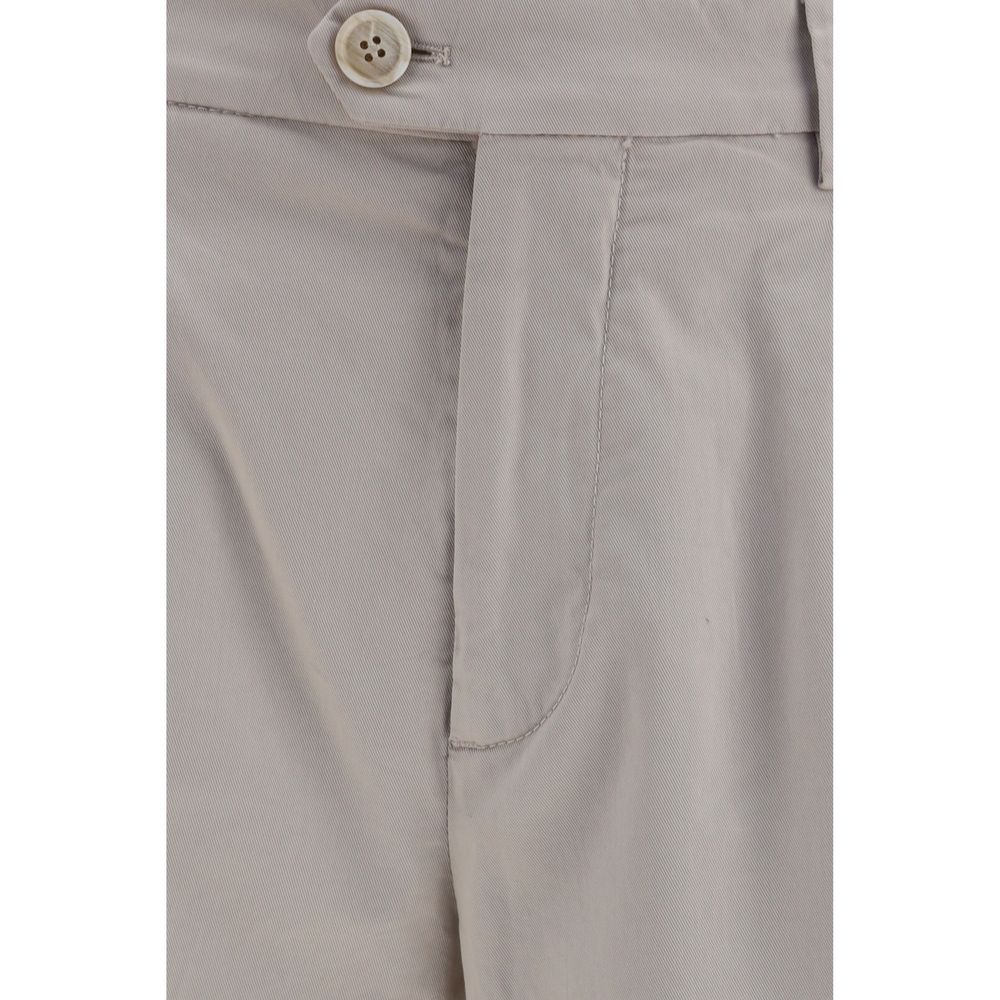 Discover the Brunello Cucinelli Beige Cotton Chino Pants, a masterpiece of craftsmanship in a luxurious cotton blend, perfect for elevating your sophisticated wardrobe.