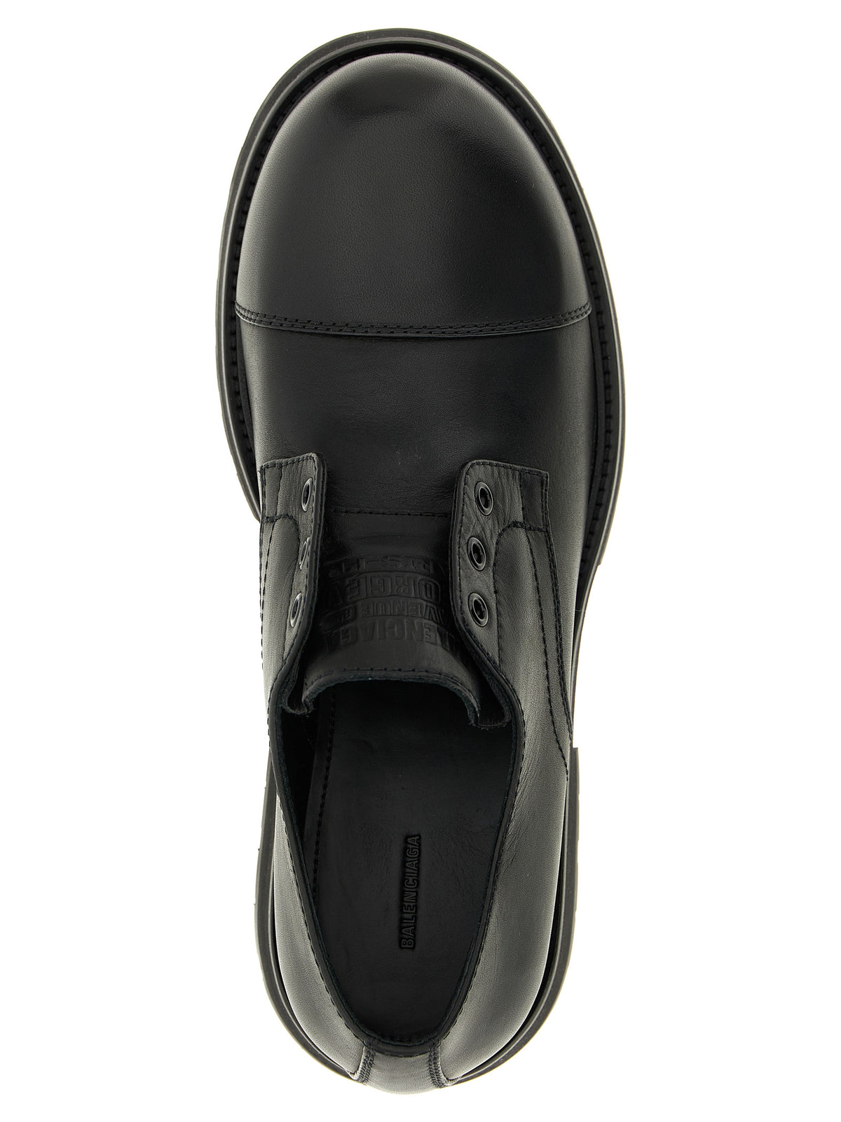 Indulge in the exquisite Balenciaga Black Bull Skin Slip-On Loafers, crafted from premium bull leather in Italy, embodying luxury and sophistication for the discerning individual.
