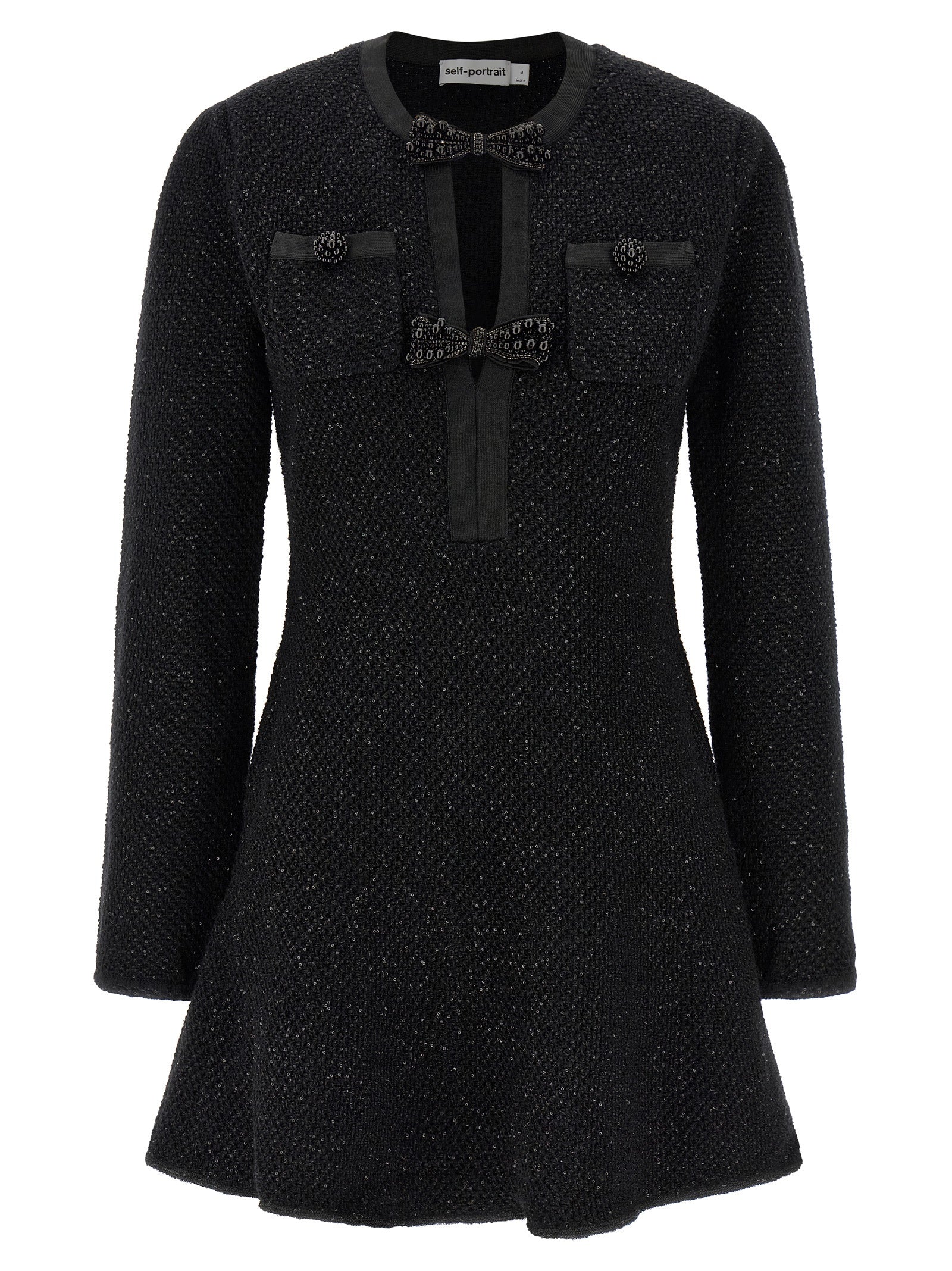 Discover the Self-Portrait Black Sequin Knit Mini Dress, a masterpiece of luxury crafted from a sumptuous blend of cotton and wool, designed to elevate your elegance and allure.