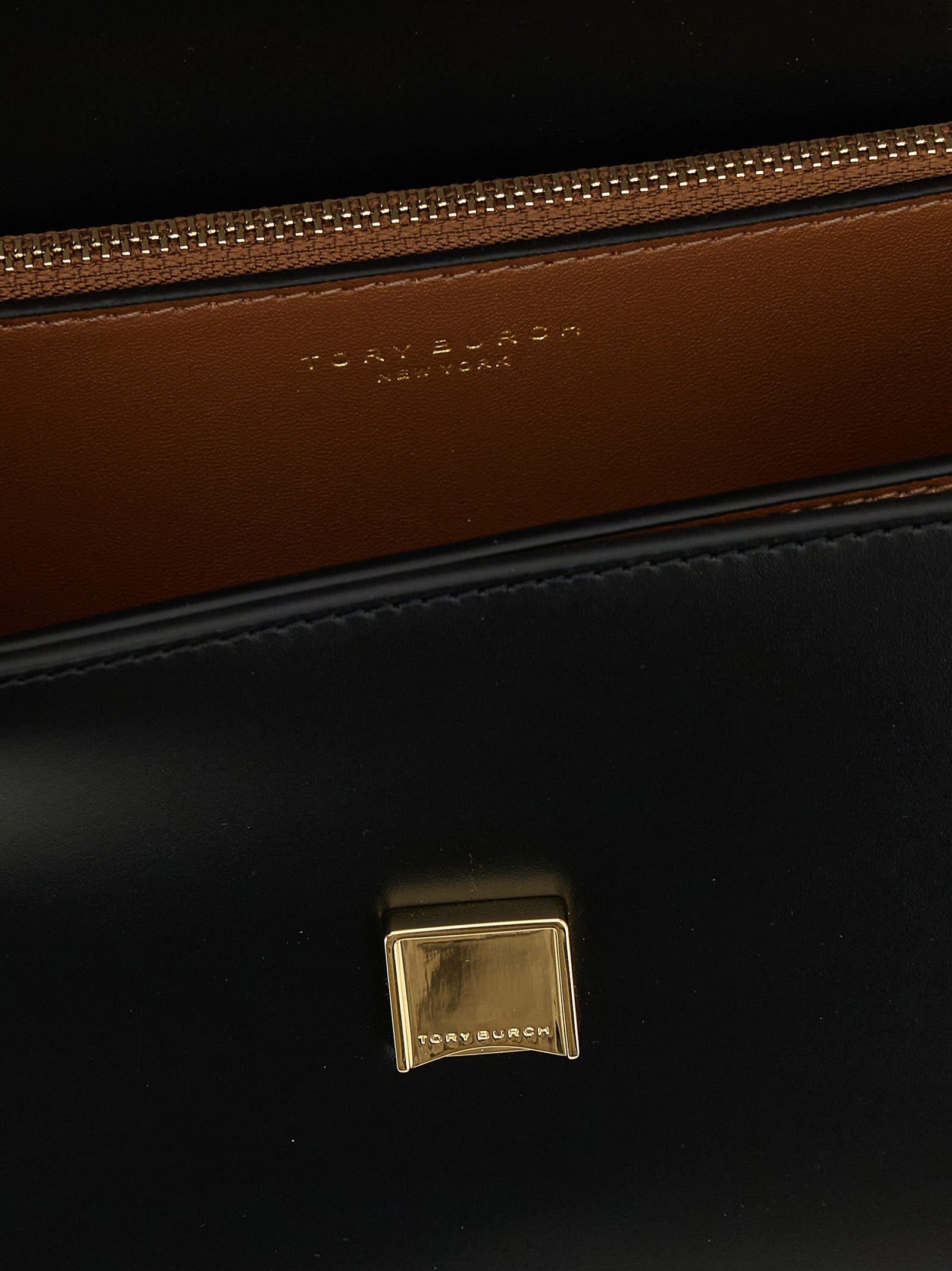 Elevate your style with the Tory Burch Black Calfskin Crossbody Bag, a masterpiece of luxury crafted from exquisite calfskin leather, perfect for any occasion.