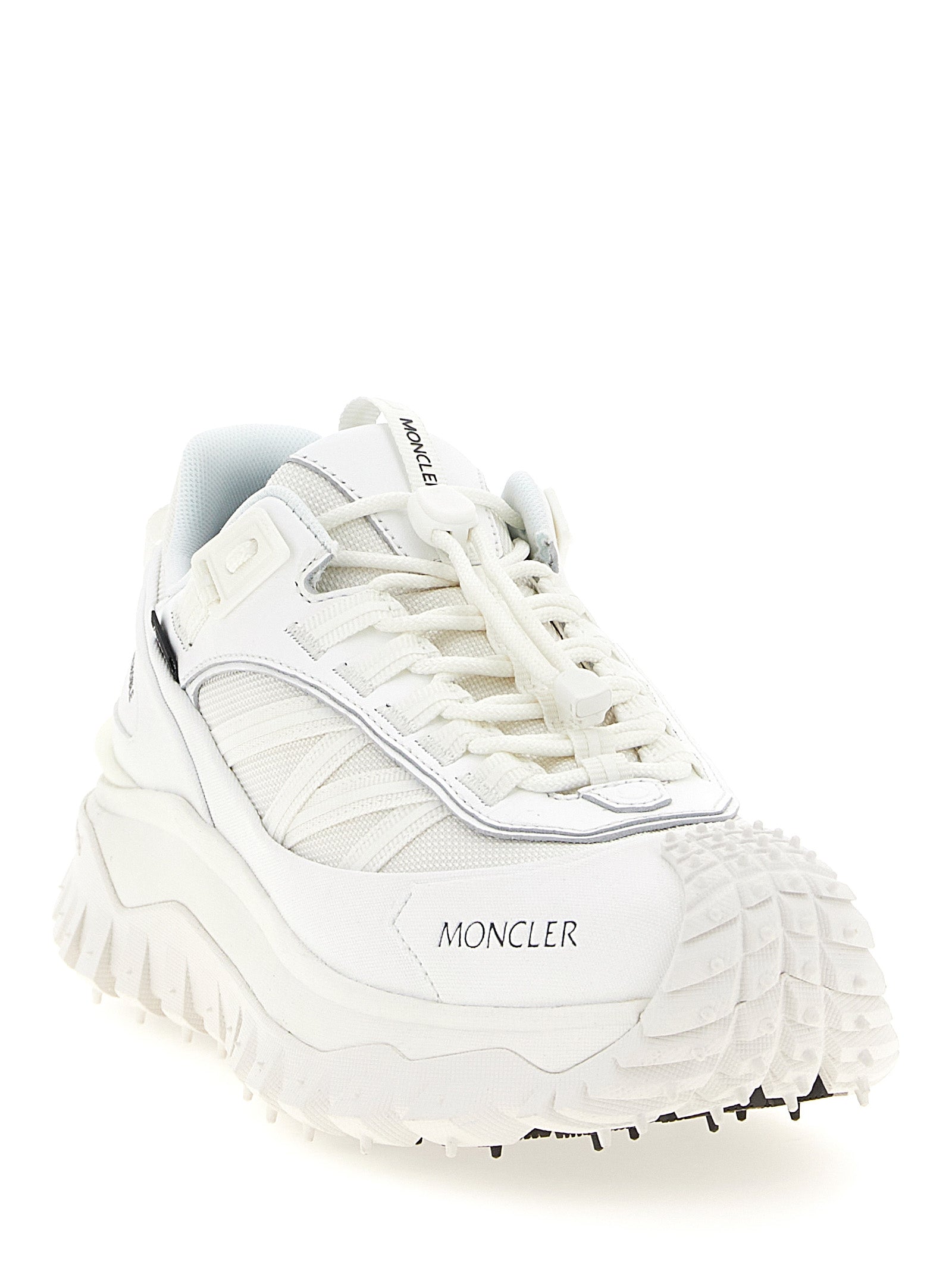 Step into luxury with Moncler's Trailgrip GTX sneakers, crafted from premium materials for unparalleled comfort and style, perfect for the modern connoisseur.