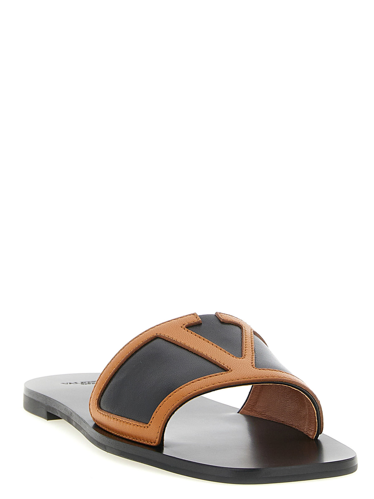 Indulge in the exquisite Valentino Garavani Brown Lamb Leather Slides, where luxurious craftsmanship meets effortless elegance, perfect for discerning tastes.