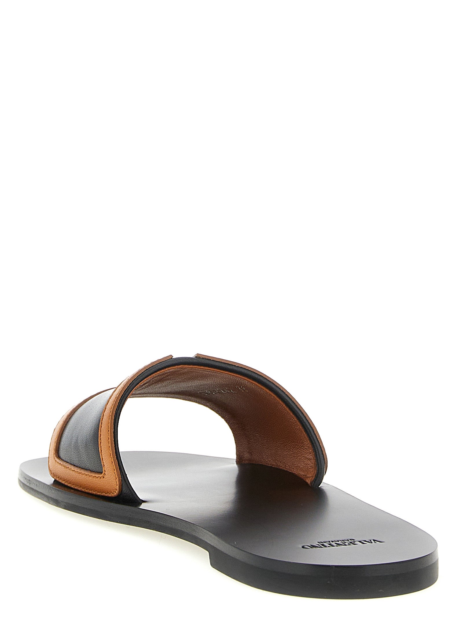 Indulge in the elegance of Valentino Garavani Brown Lamb Leather Slides, where Italian craftsmanship meets luxurious comfort for the discerning connoisseur.