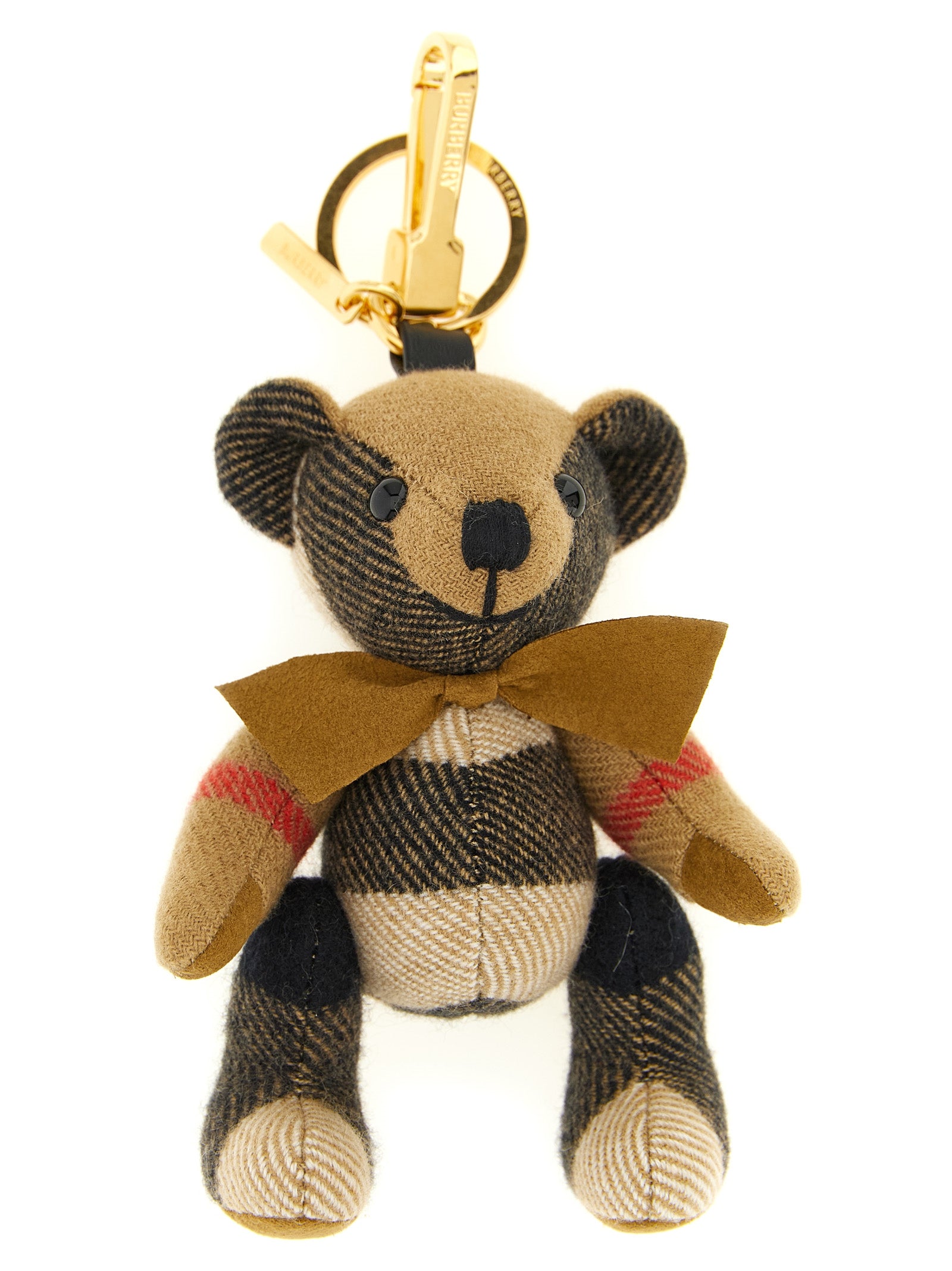 Indulge in the Burberry Beige Cashmere Keychain, a luxurious blend of exquisite craftsmanship and whimsical design, perfect for elevating your accessory game.