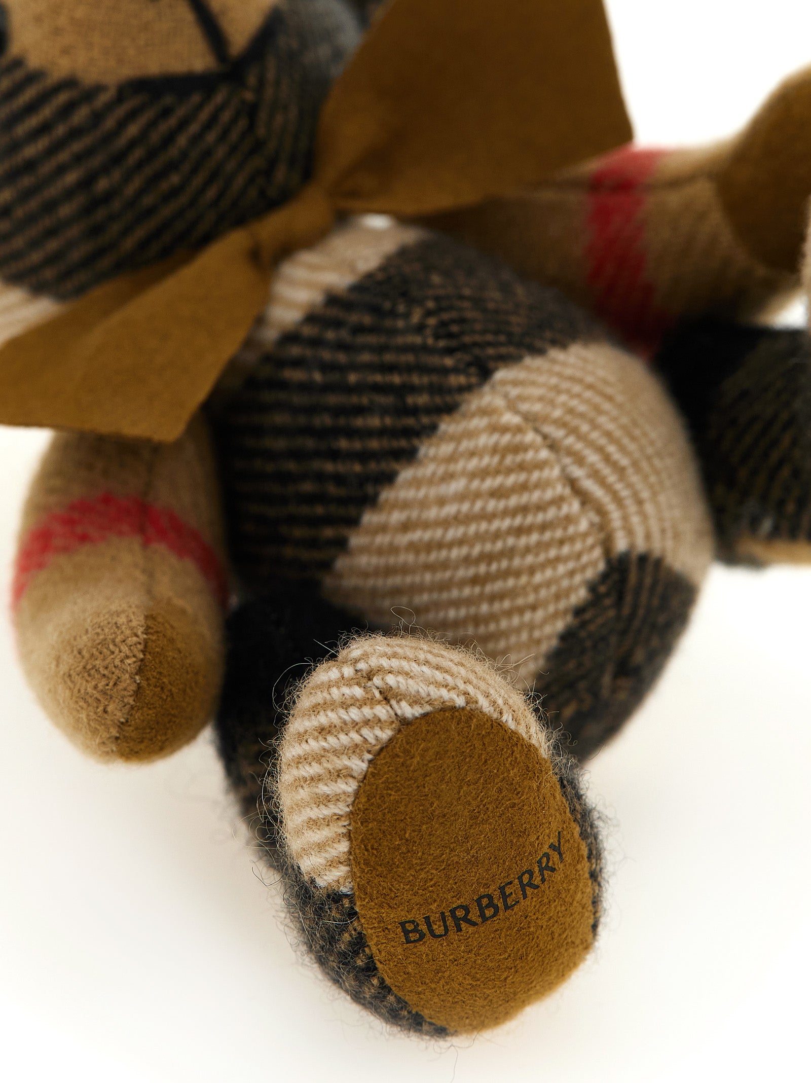 Elevate your style with the Burberry Beige Cashmere Keychain, a luxurious blend of exquisite craftsmanship and whimsical design, perfect for the discerning individual.