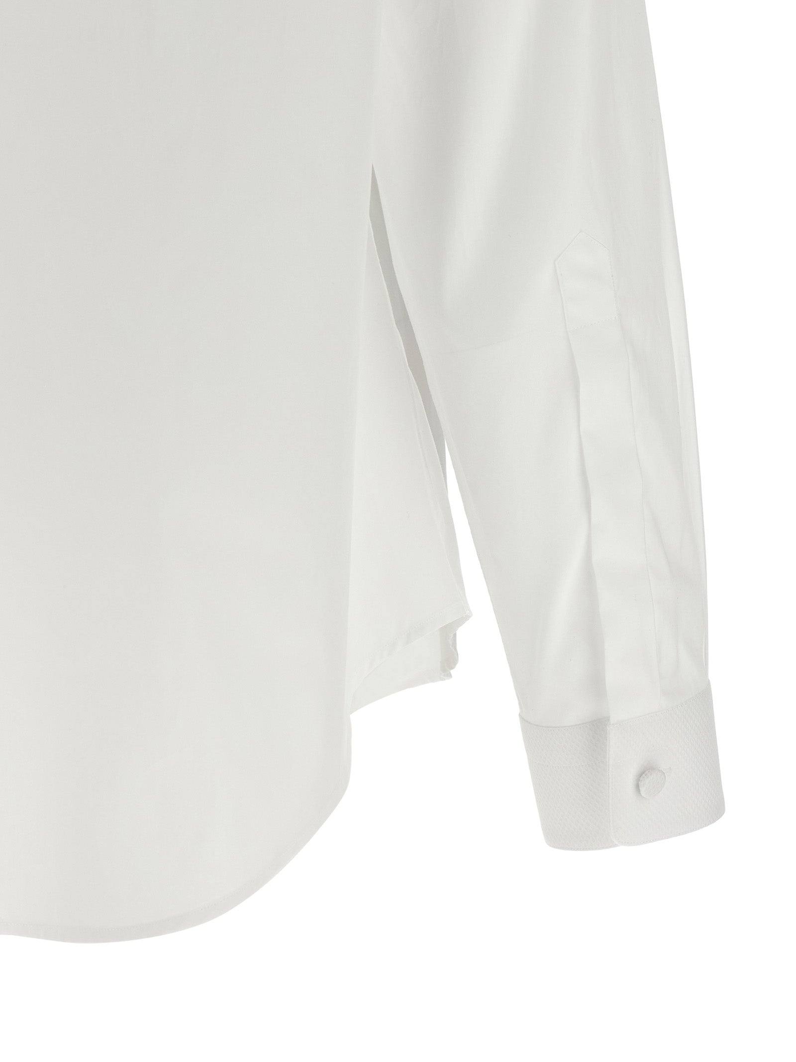 Experience the exquisite Tom Ford White Cotton Blouse, a timeless masterpiece of haute couture crafted from luxurious cotton, embodying elegance and sophistication for the discerning individual.