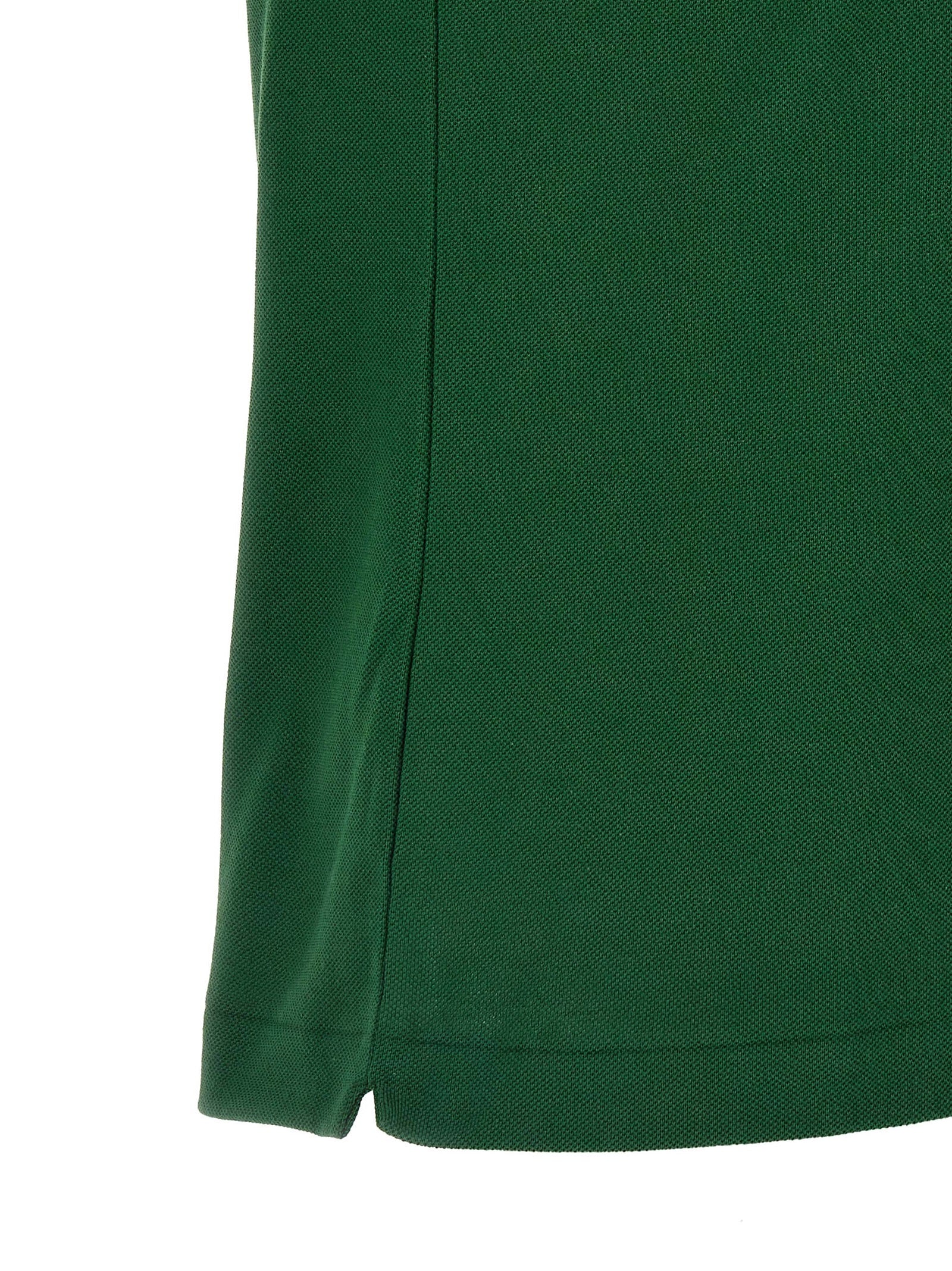 Experience the essence of elegance with the Lacoste Bicolor Cotton Polo Shirt, crafted from premium cotton for unparalleled comfort and timeless sophistication.