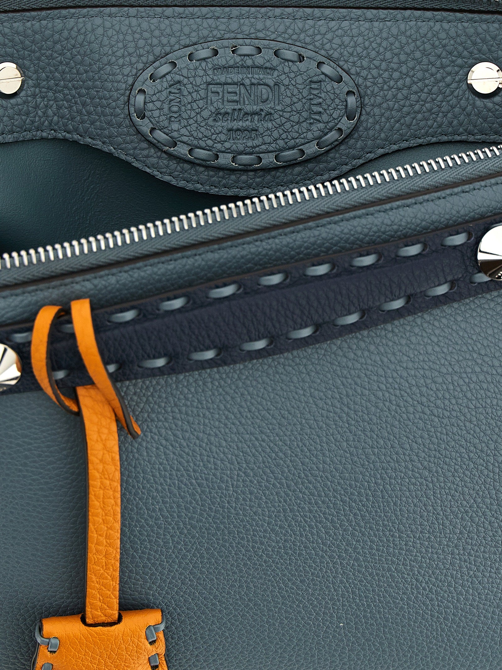 Discover the Fendi Blue Calfskin Handbag, a masterpiece of artisanal craftsmanship in luxurious calfskin leather, embodying elegance and sophistication for the discerning individual.