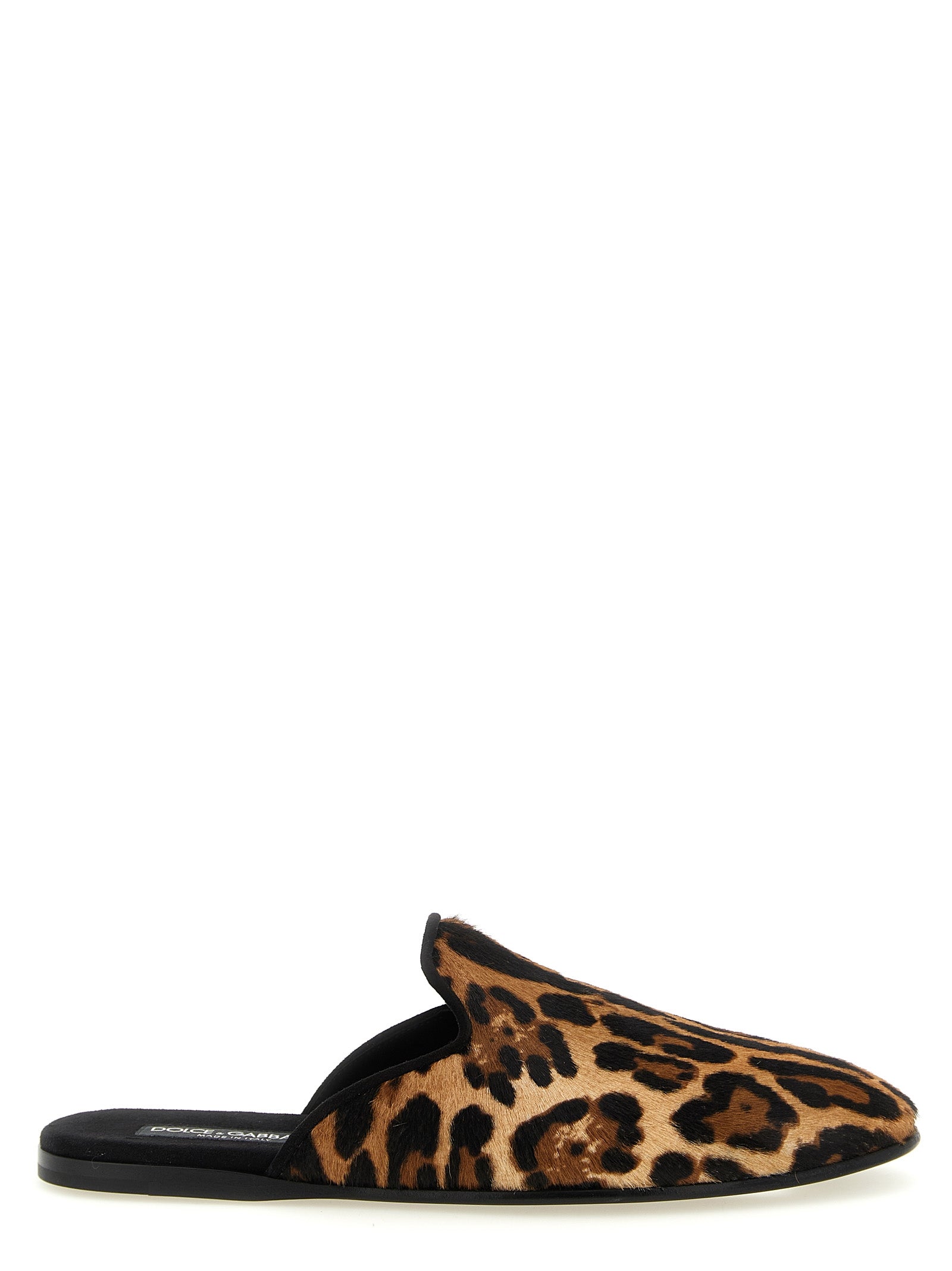 Step into unparalleled luxury with Dolce & Gabbana's Brown Calfskin Flats, where exquisite craftsmanship meets bold design, perfect for the discerning connoisseur.