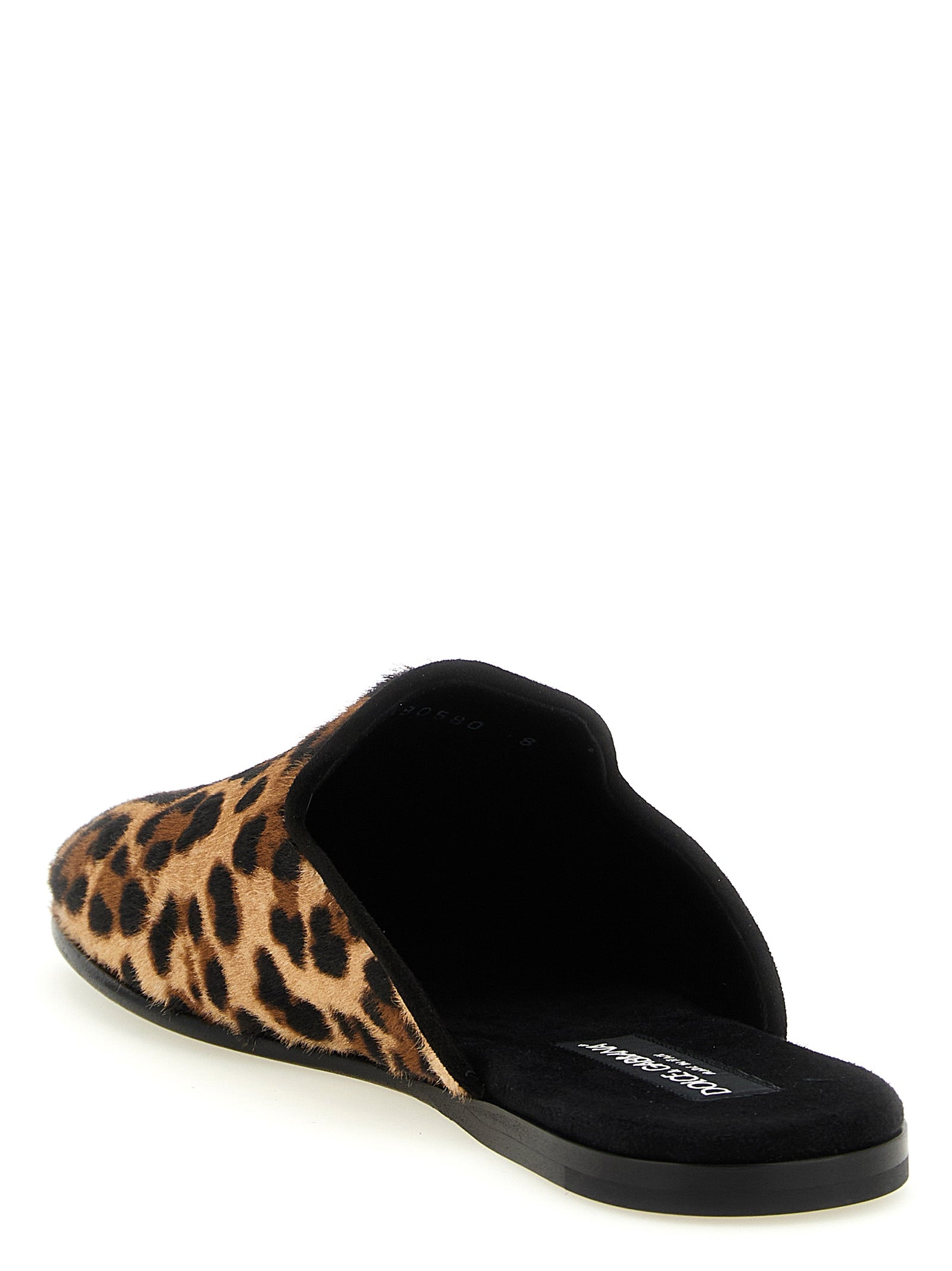 Indulge in the exquisite Dolce & Gabbana Brown Calfskin Flats, where luxurious pony-effect leather meets unparalleled artisanship, perfect for those who command attention.