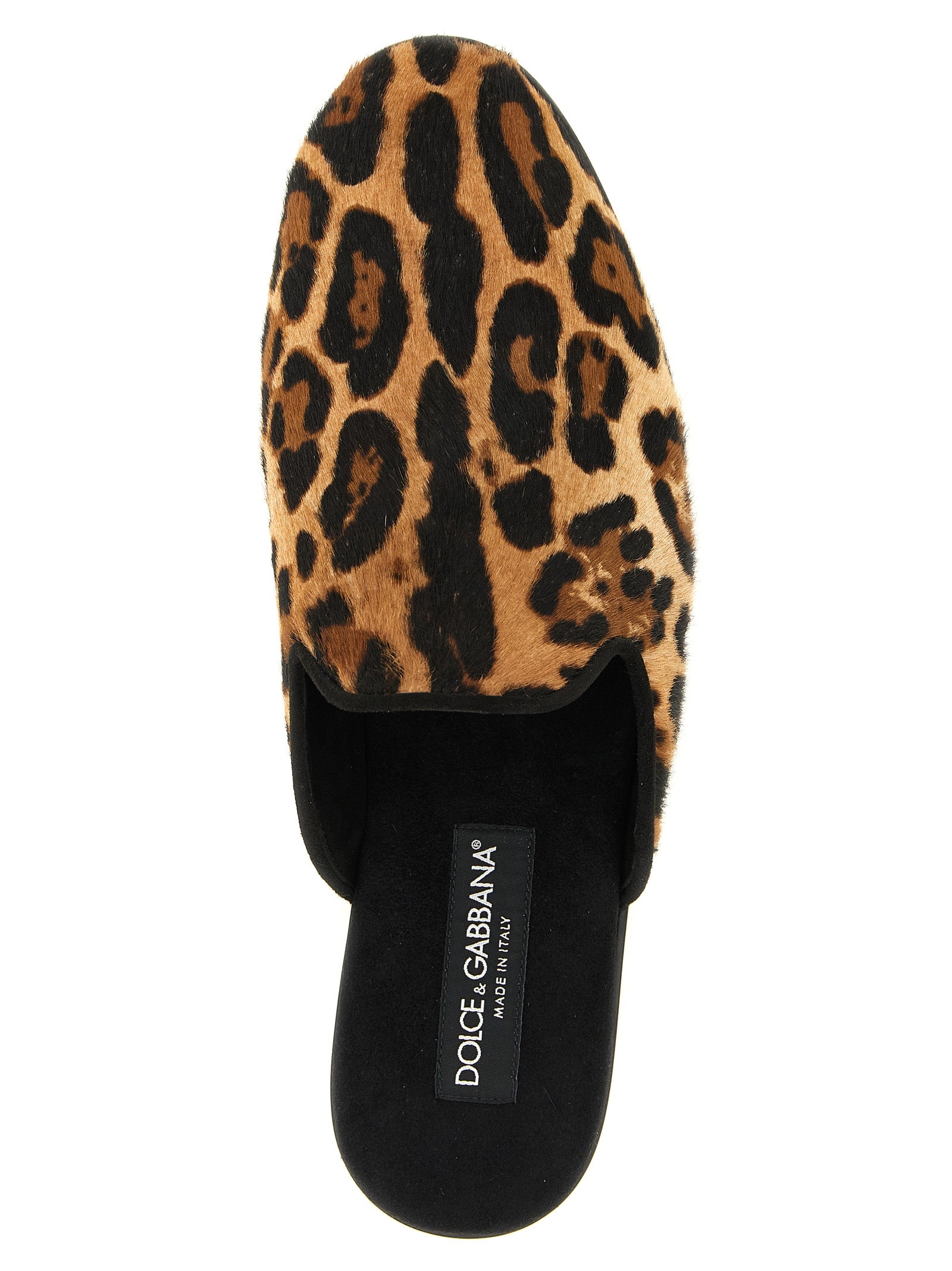 Step into the realm of luxury with Dolce & Gabbana's Brown Calfskin Flats, where exquisite craftsmanship meets bold design, perfect for the discerning individual.