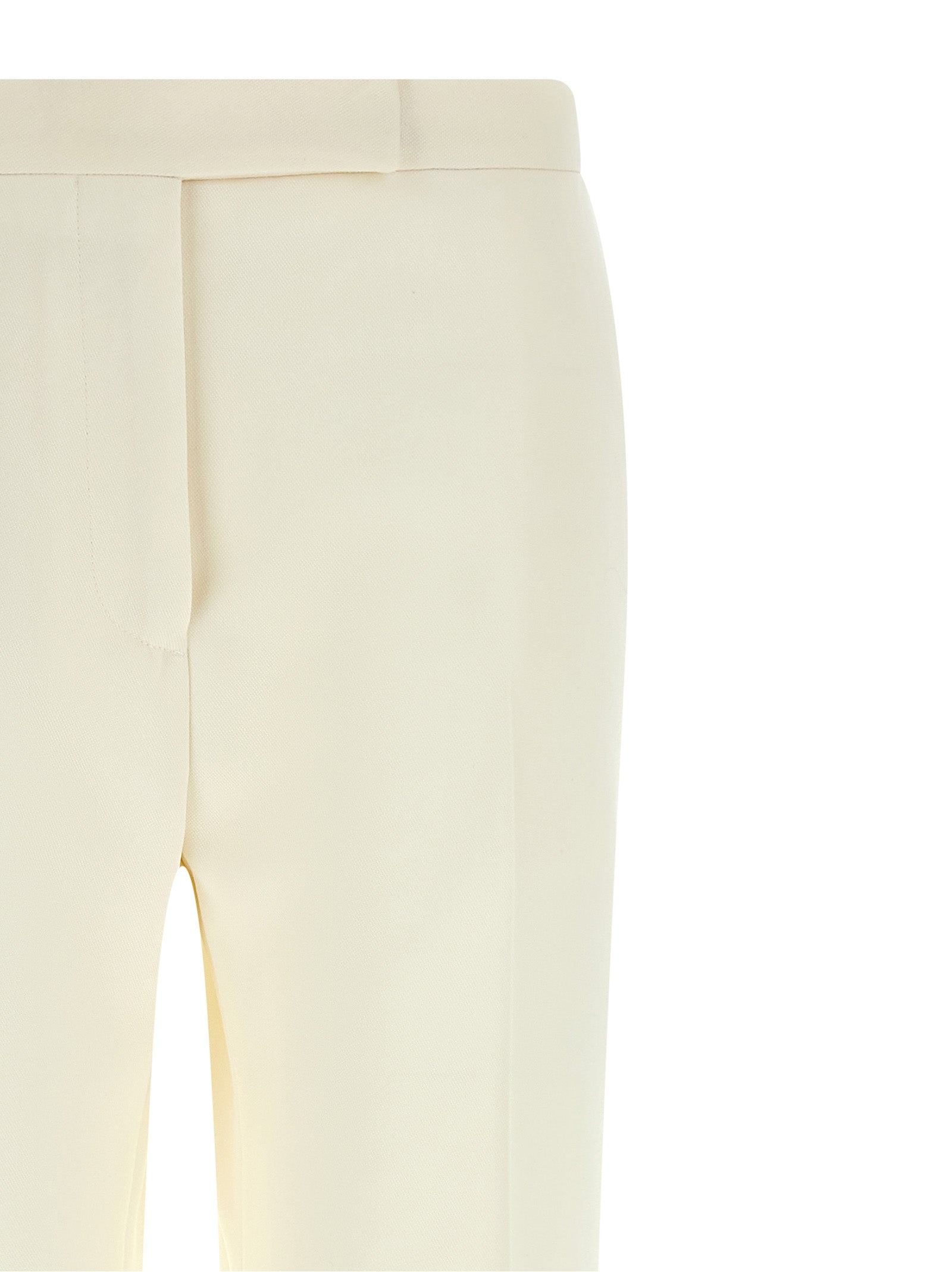 Elevate your elegance with Tom Ford's White Wool Tuxedo, a masterpiece in luxurious grain de poudre wool, designed for the discerning fashionista seeking timeless sophistication.