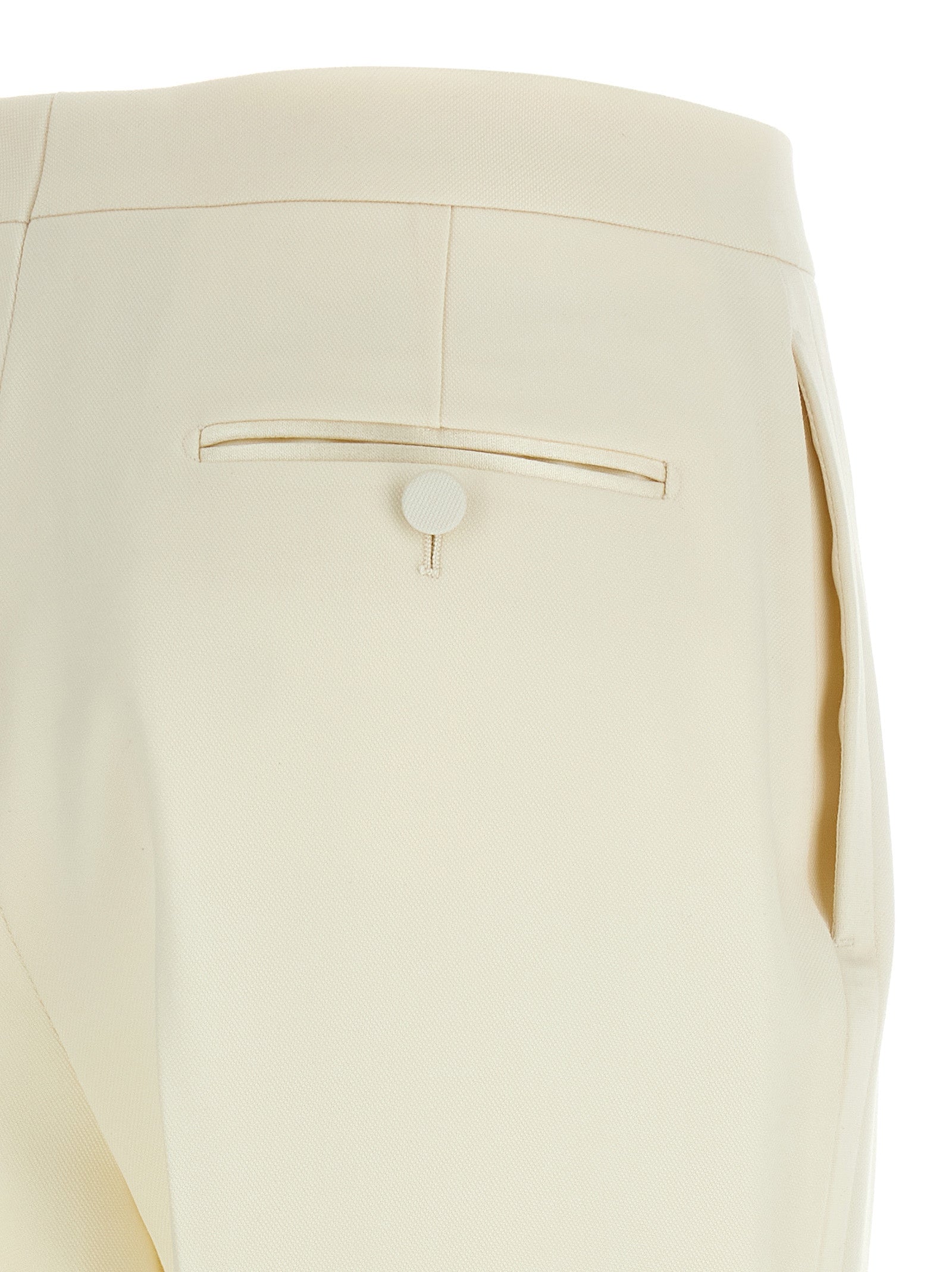 Elevate your elegance with Tom Ford's White Wool Tuxedo, crafted in luxurious grain de poudre wool, embodying sophistication and timeless allure for the discerning fashionista.