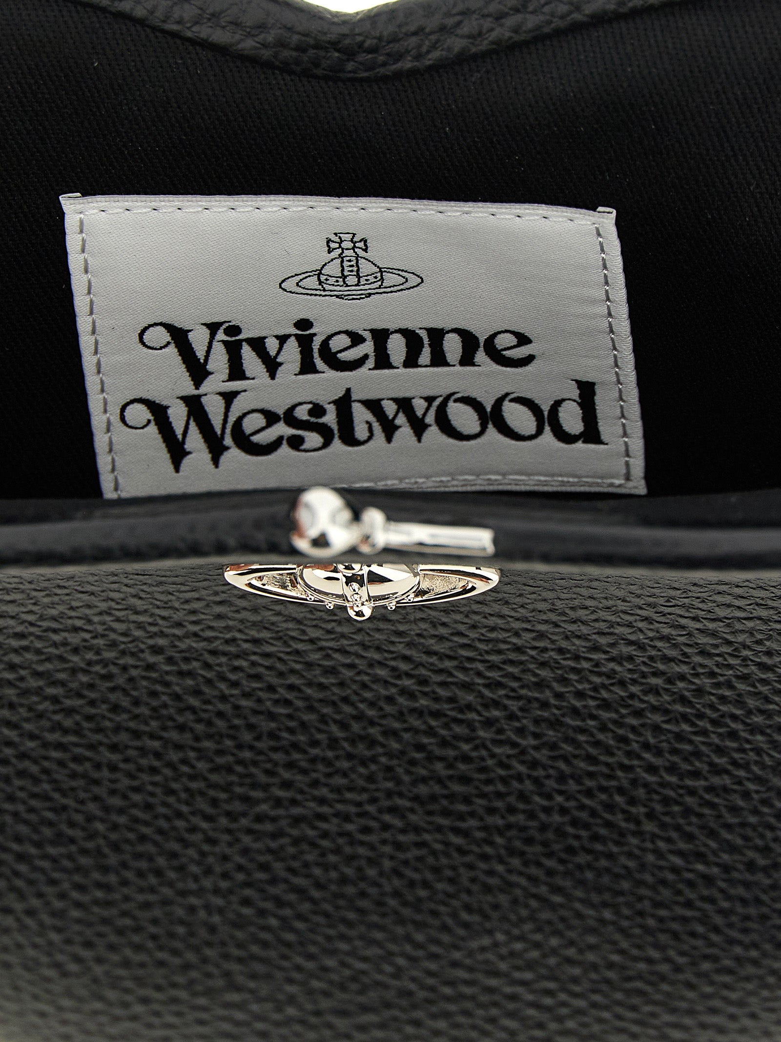Indulge in the allure of the Vivienne Westwood Black Polyethylene Handbag, a luxurious statement piece crafted from premium polyurethane, embodying elegance and bold sophistication.
