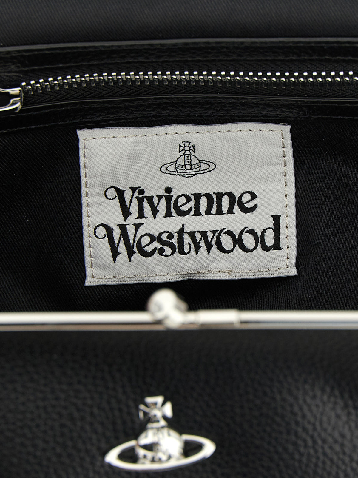 Elevate your style with the Vivienne Westwood Black Polyethylene Handbag, a masterpiece of craftsmanship and luxury, perfect for the discerning fashion aficionado.