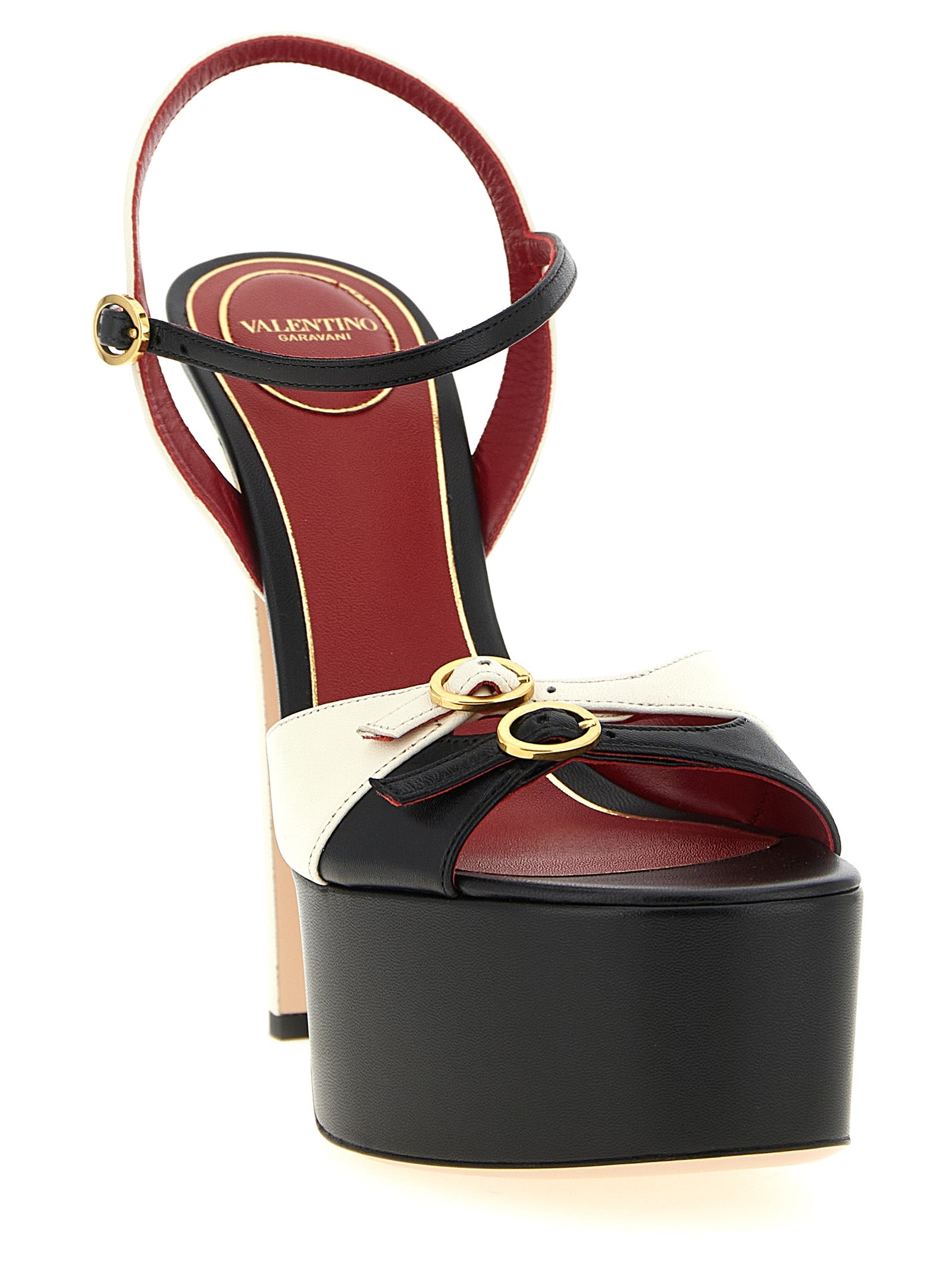 Step into the realm of elegance with Valentino Garavani Bicolor Calfskin Stiletto Heel Sandals, where exquisite craftsmanship meets timeless luxury for the discerning individual.