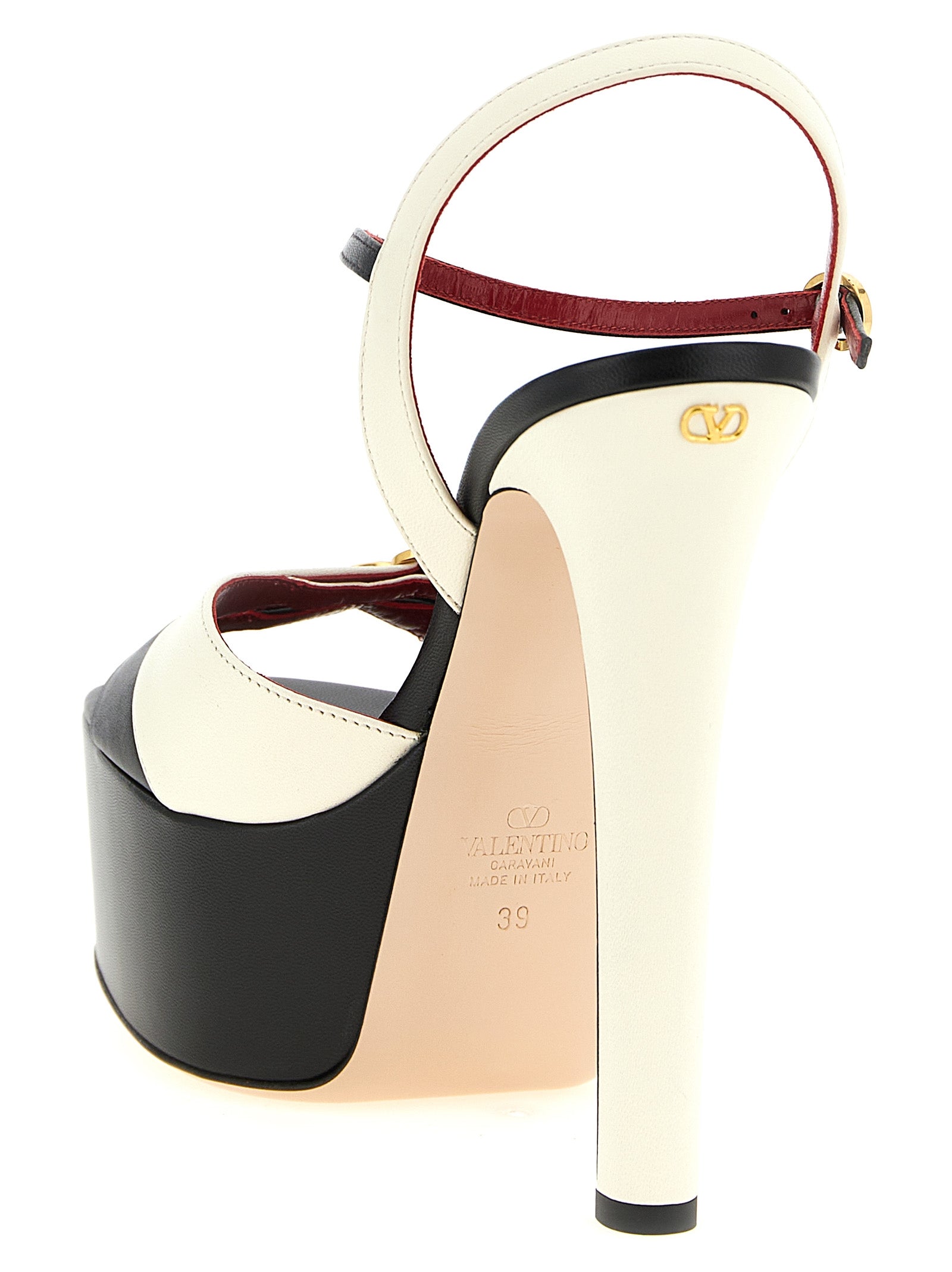 Discover the Valentino Garavani Bicolor Calfskin Stiletto Heel Sandals, a masterpiece of Italian craftsmanship that embodies elegance and sophistication for the discerning individual.