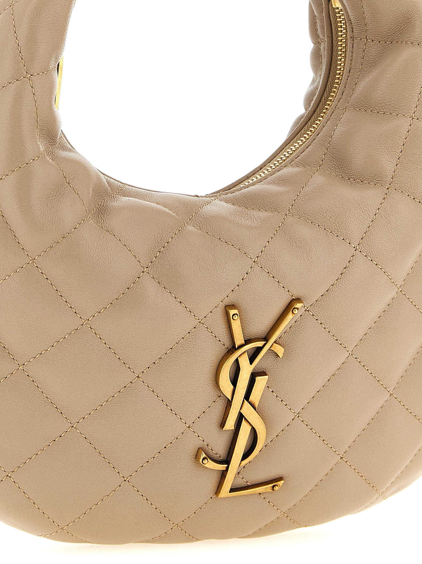 Discover the Saint Laurent Beige Lamb Leather Handbag, a masterpiece of Italian craftsmanship, blending elegance and sophistication for the discerning individual.